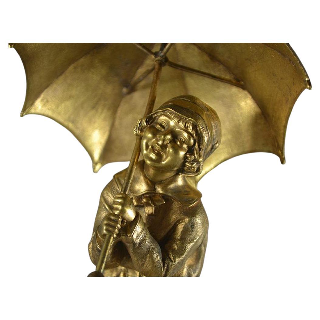 Dh. Chiparus (1886-1947)

An hard to find bronze figure of a little girl with umbrella.
Onyx base.
Signed on the bronze umbrella.
Excellent condition.
Circa 1925.
24.5cm high

Catley, Art Deco and other figures, second edition. Page 99.