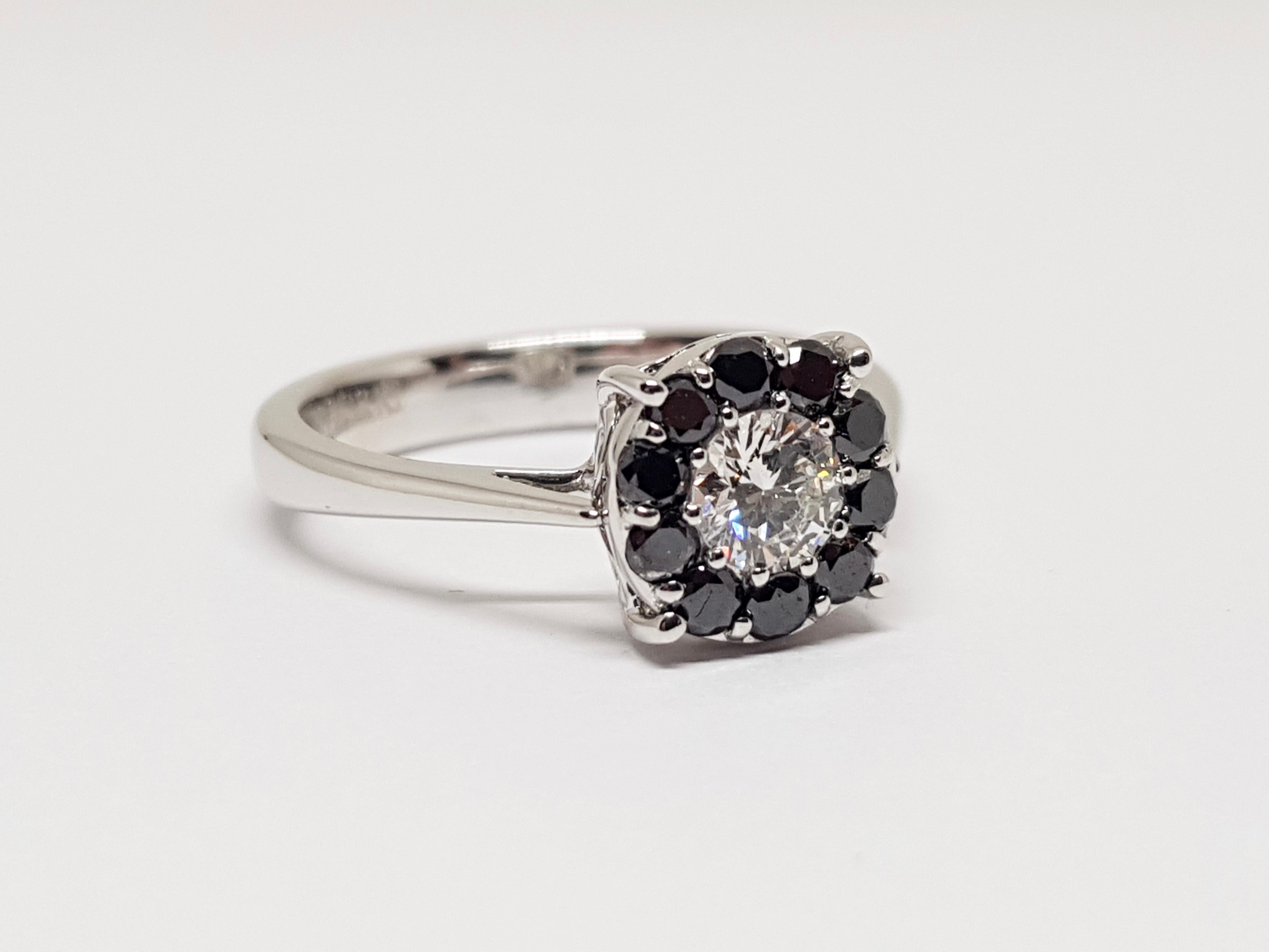 Signed Dhamani 750
Gold: 18 Carat White gold
Weight: 4.92 gr.
Central Diamond: 0.55ct. E / VVS1
Accent Diamonds: 0.30ct. Black Diamonds
Ring size: 57 / 18mm
Free resizing of Ring up to size 70 / 22mm
All our jewellery comes with a certificate and 5