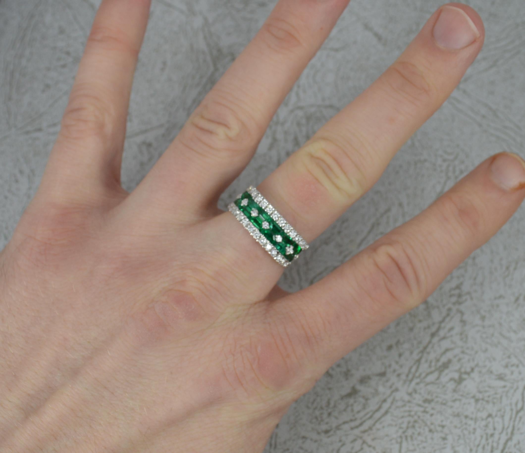 A stunning quality 18ct Gold, Emerald and Diamond cluster ring.
A heavy and substantial 18 carat white gold example.
Made and designed by Di Go, a fine Italian jewellers.
Four row design with round brilliant cut natural diamonds and emerald cut