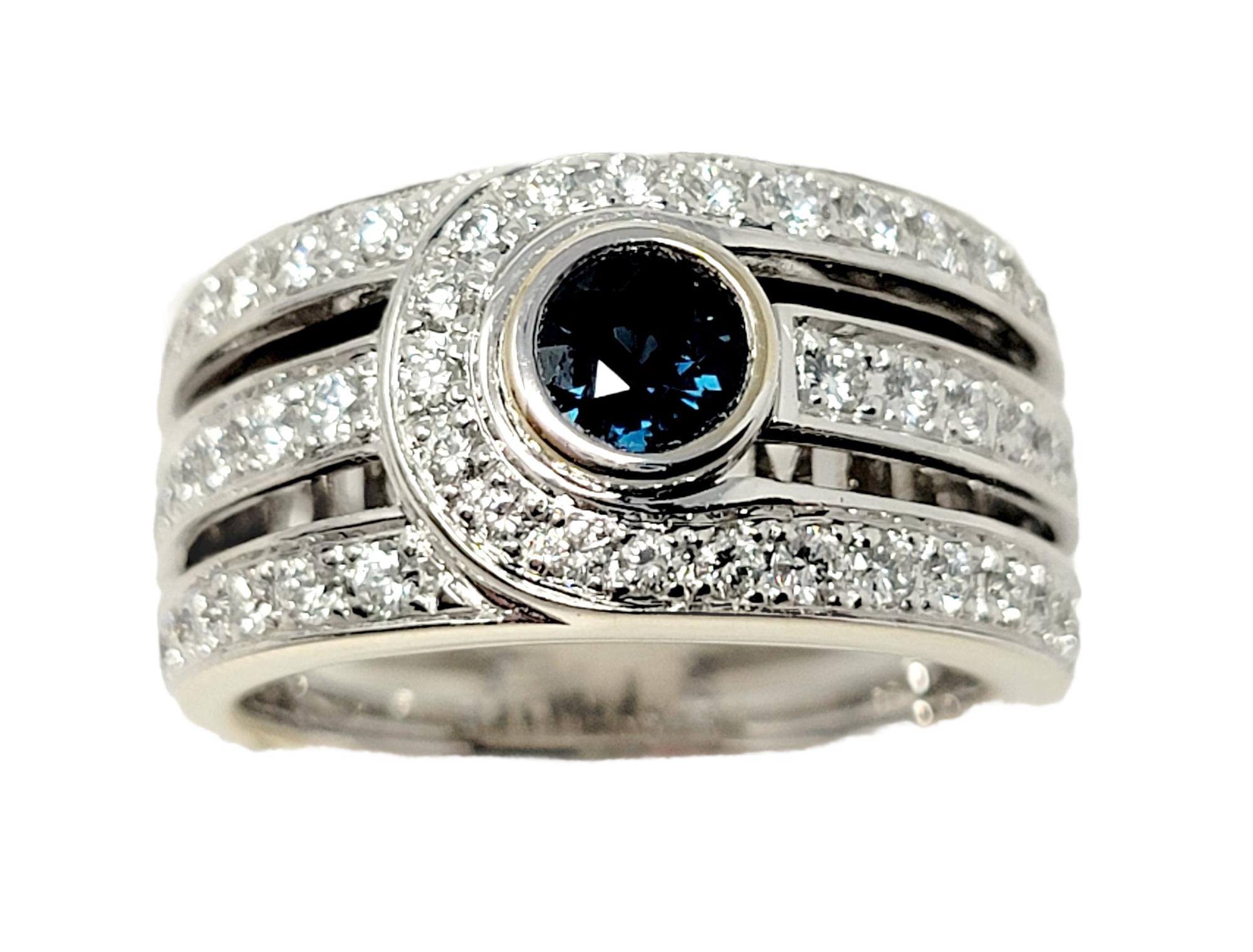 Taille de l'anneau : 6.75

L'anneau contemporain à plusieurs rangs du designer Di Modelo brille et resplendit grâce à ses diamants étincelants, tandis que le saphir central ajoute une élégante touche de couleur. 

Type de bague : Anneau
Métal : Or