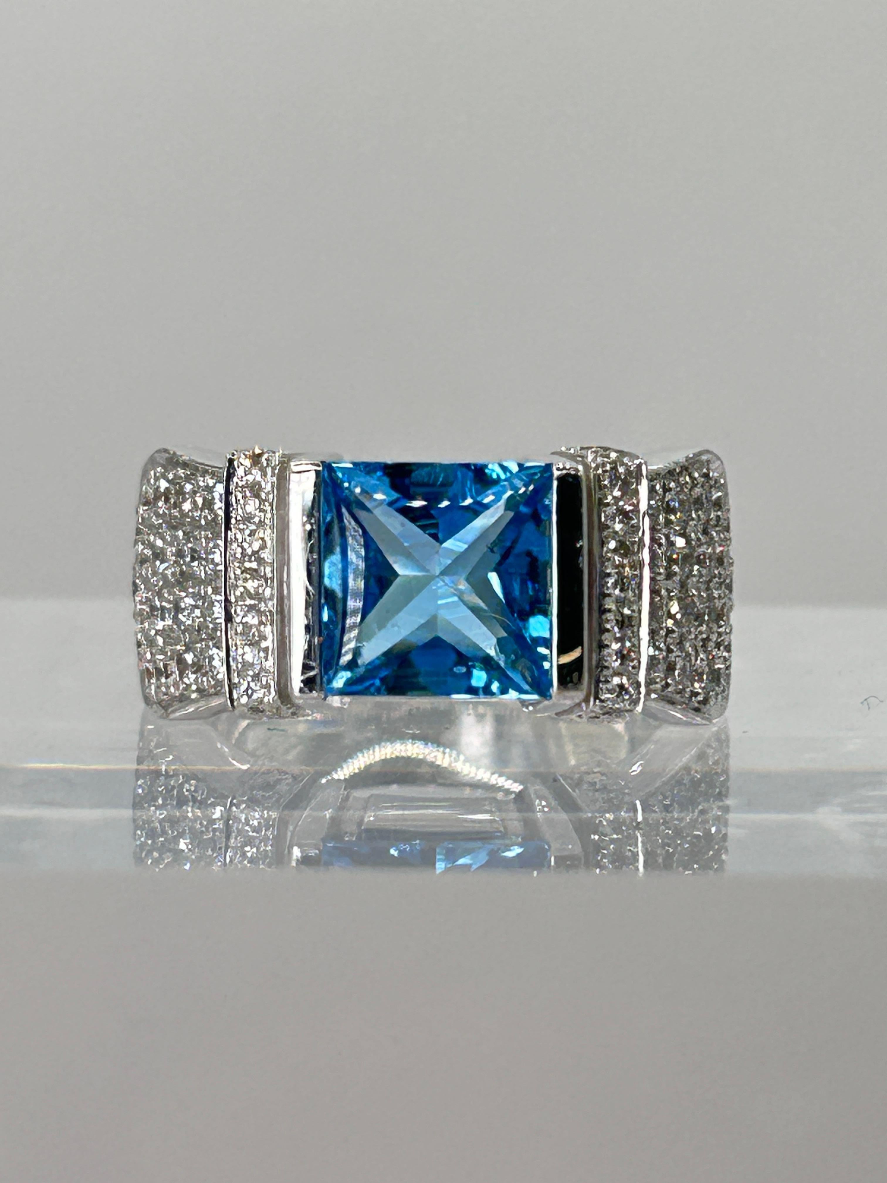 Di MODOLO Milano Blue Topaz and Diamond Ring set in 18 Karat White Gold.
Diamond Total Weight is 1.00 Carat, Blue Topaz Measures 8 mm x 8 mm x 4.6 mm.