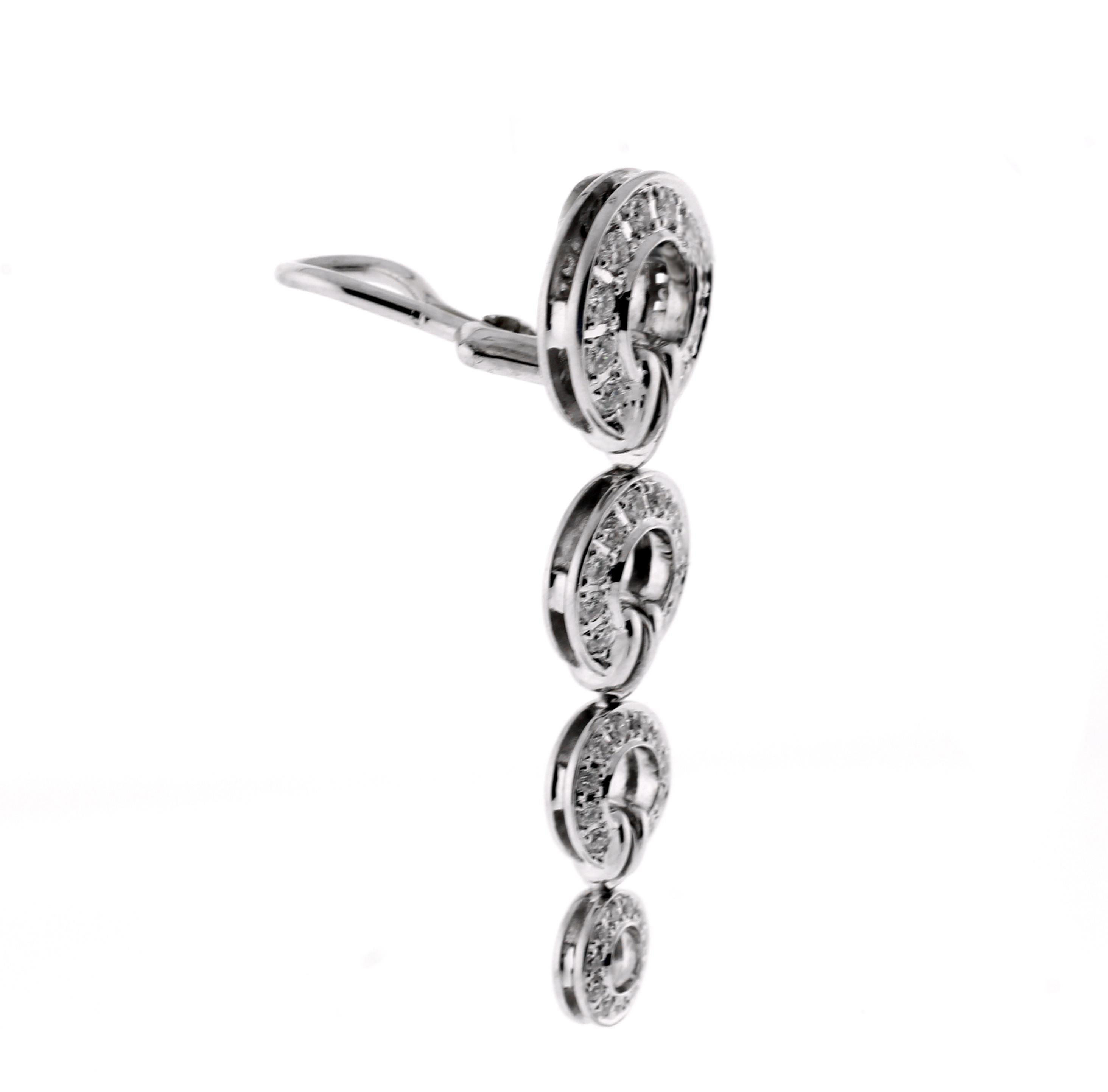 From Di Modolo’s Tempia collection, a pair of diamond circle drop earrings.
Designer: Di Modolo
• Metal: 18 karat white gold
• Circa:  late 20th century
• Size: 1 ½ inches long, half inch wide
• Diamond: 88 diamonds 1.44carats
• Packaging: