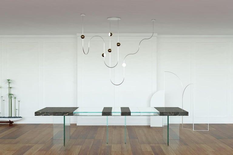 Dia is a sculptural chandelier inspired by the heterophony of natural sound. Each frame (or melody) is hand-rolled with all joints cleverly concealed within the circular light source, the playful LED light sources disperse ambient light in all