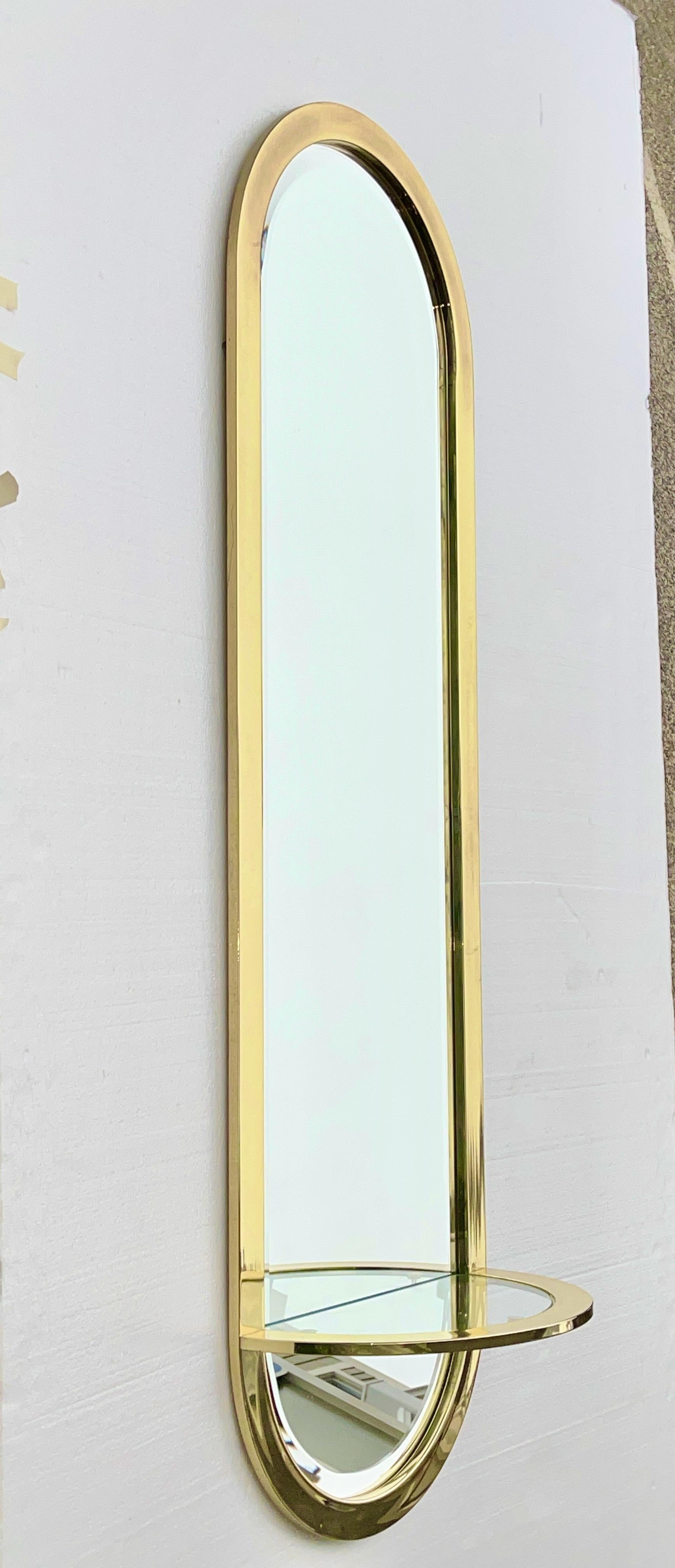 Beveled DIA Design Institute America Brass Racetrack Oval Mirror with Demilune Shelf For Sale