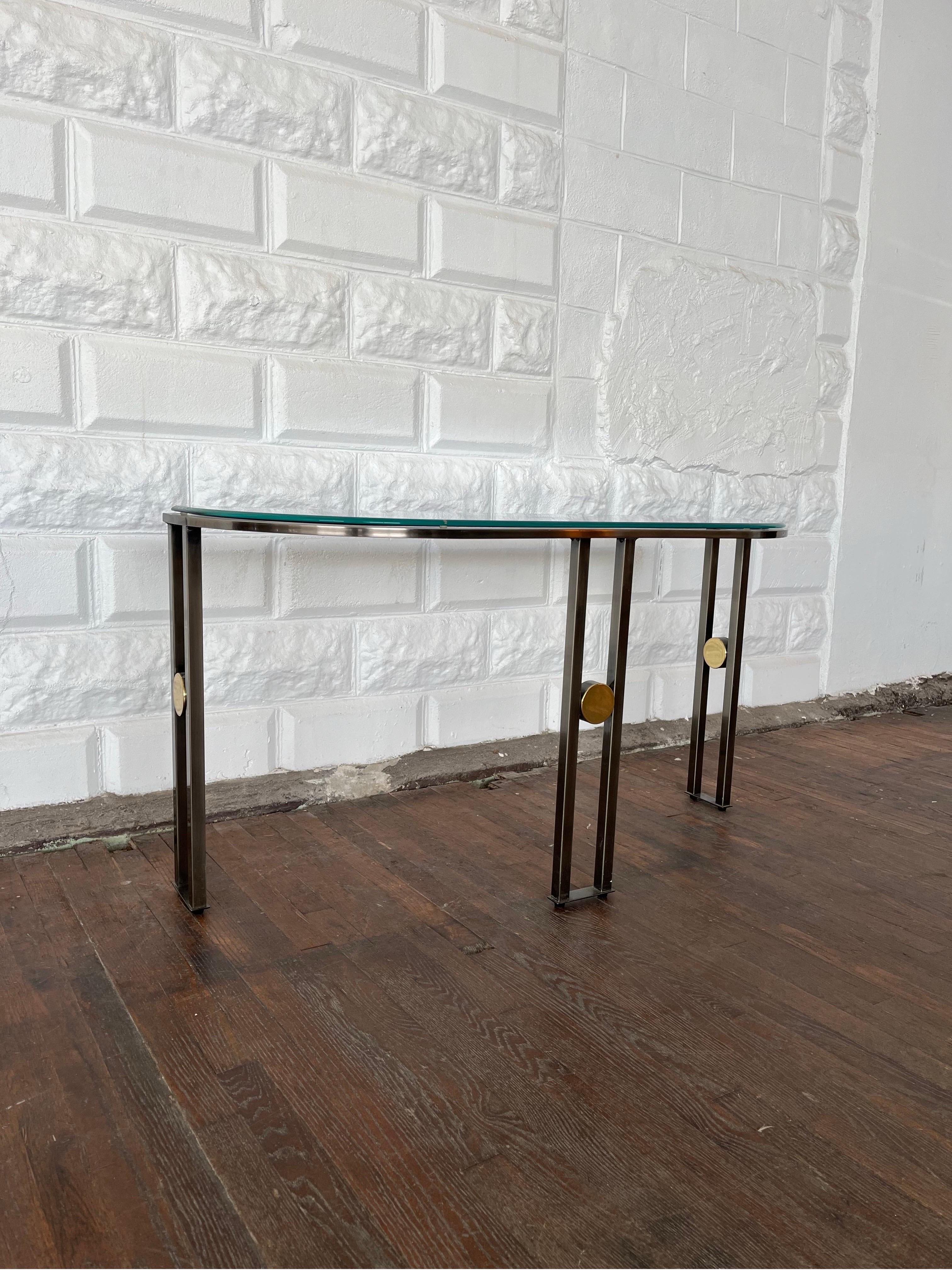 Fantastic Art Deco Revival Demilune Console or Sofa Table by Design Institute Ameria(DIA). Brushed chrome frame offset with brass medallions. Beveled glass top with OG edge. Truly wonderful lines with simplicity that packs a punch.
Curbside to