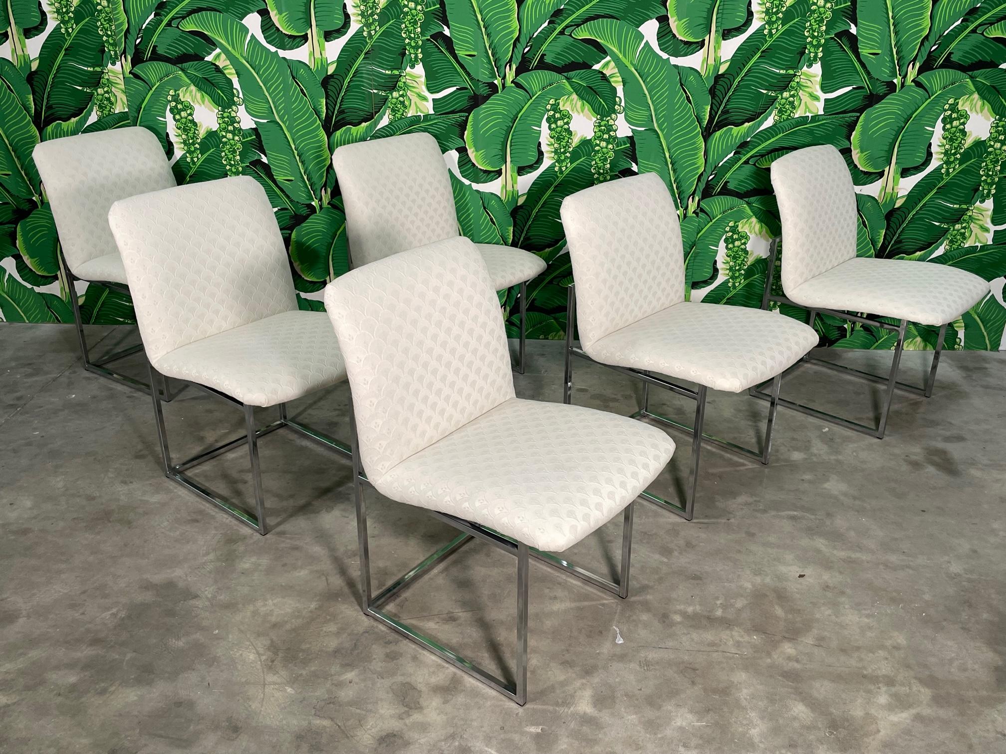 Set of six mid century modern chrome dining chairs by Design Institute of America. Features the iconic thin line frame and simple, modern styling. Good condition with minor imperfections consistent with age, see photos for condition details. 
For a