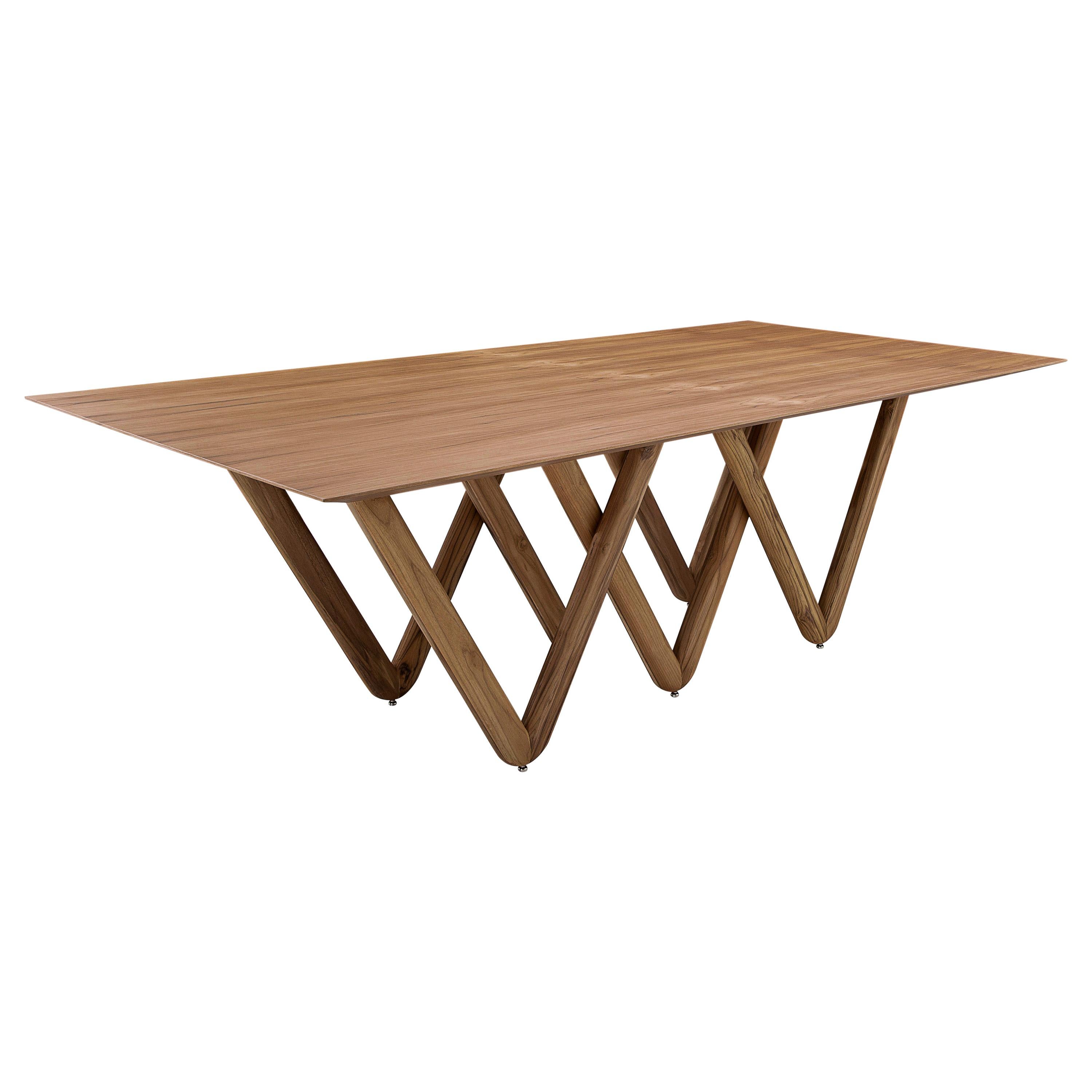 The Dablio dining table features a teak wood finish intersecting a V-shaped base that is highlighted by a stunning teak veneered tabletop. It has a very singular and original structure and at the same time, it is a very simple but modern dining