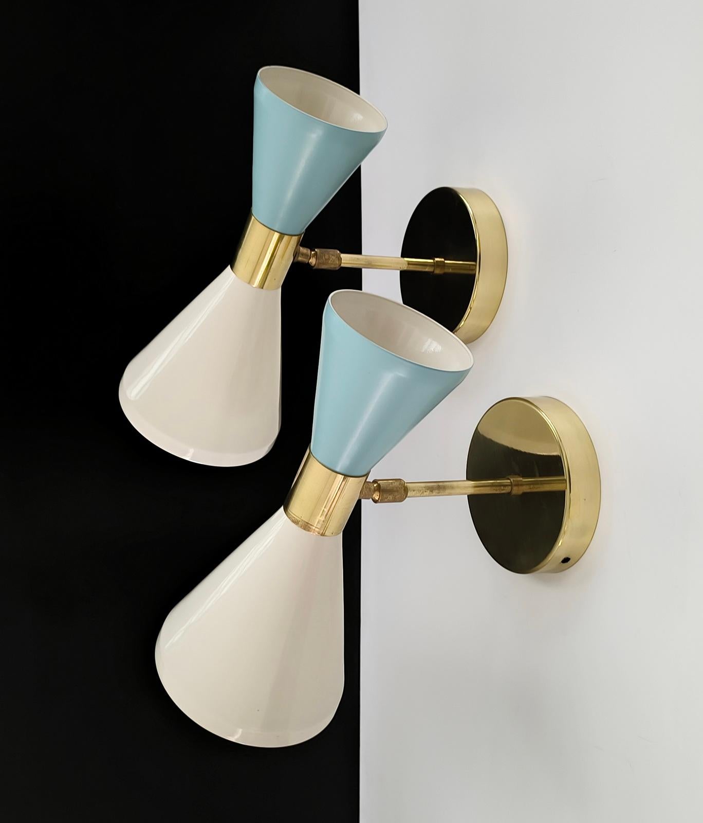 Pair of Italian Adjustable Diabolo Wall Lights, in the style of Stilnovo.
Ivory and Baby Blue lacquered shades, each with two lights.
Polished brass
Height 26 cm.
E12, or E14 sockets on request.
Optional finishes are available for an extra fee.
Any