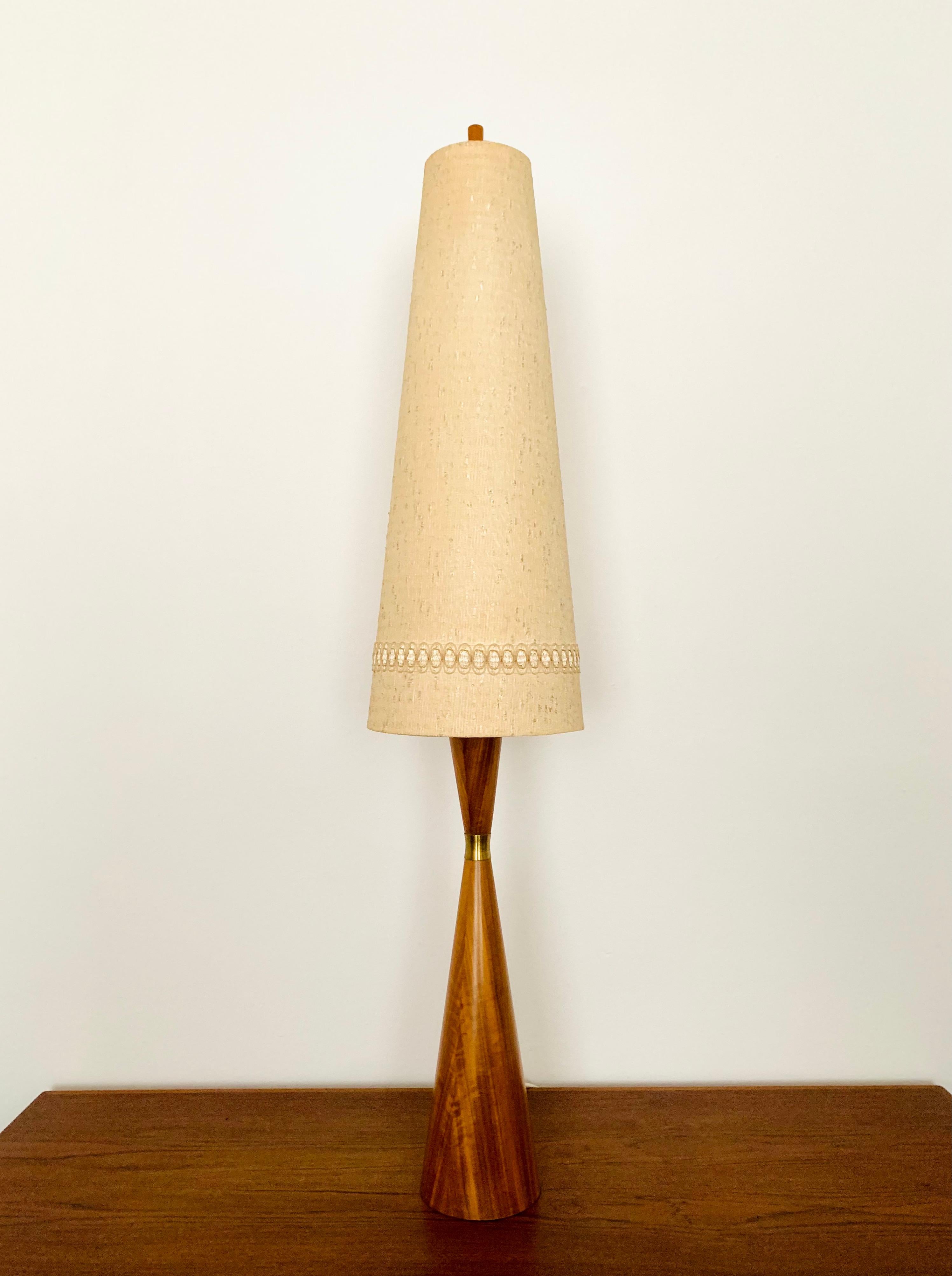 Exceptionally beautiful floor lamp from the 1960s.
The design is very unusual.
The shape and the materials create a warm and very pleasant light.

Design: Parker Knoll

Condition:

Very good vintage condition with slight signs of wear