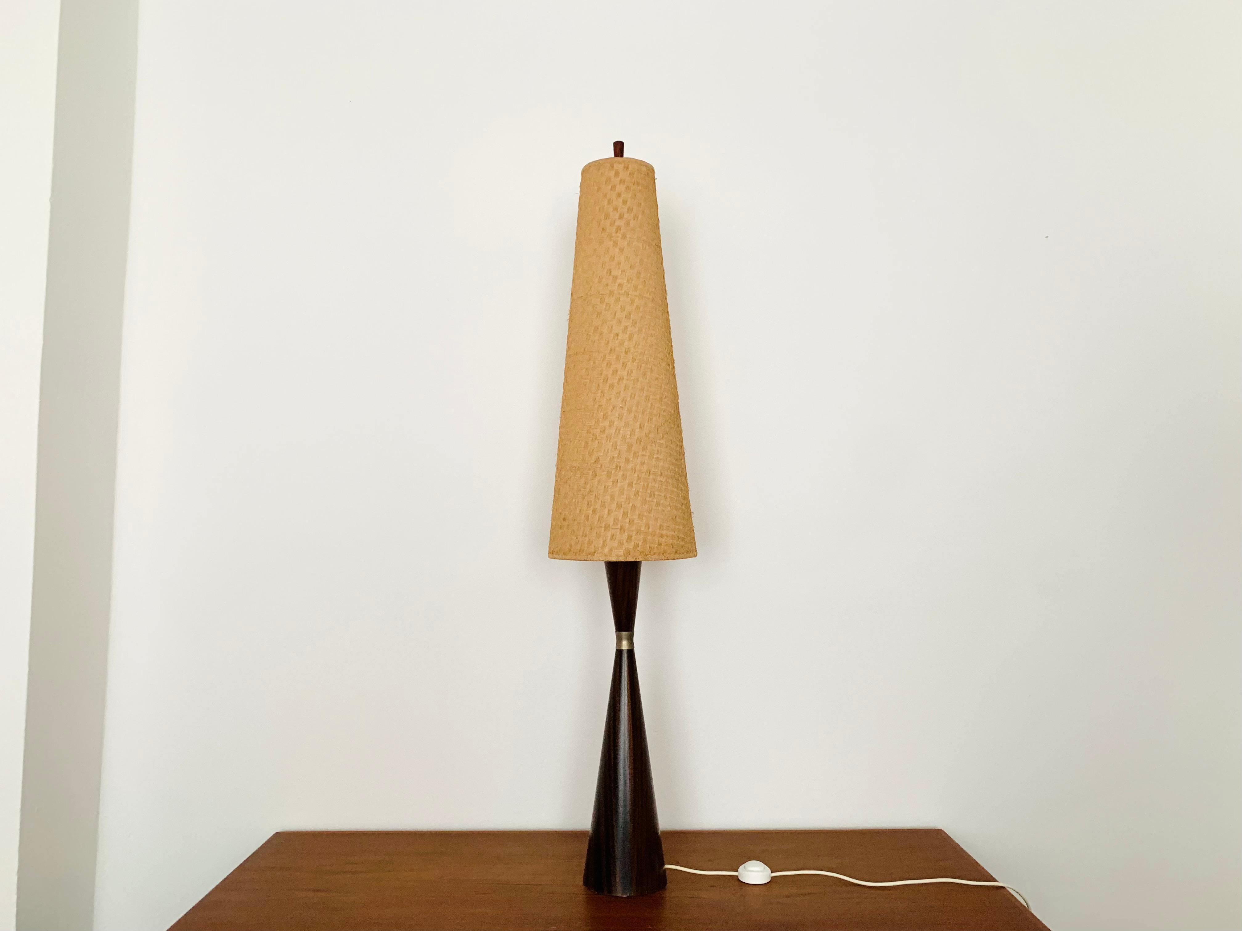 Exceptionally beautiful floor lamp from the 1960s.
The design is very elegant.
The shape and the materials create a warm and very pleasant light.

Design: Parker Knoll

Condition:

Very good vintage condition with slight signs of wear