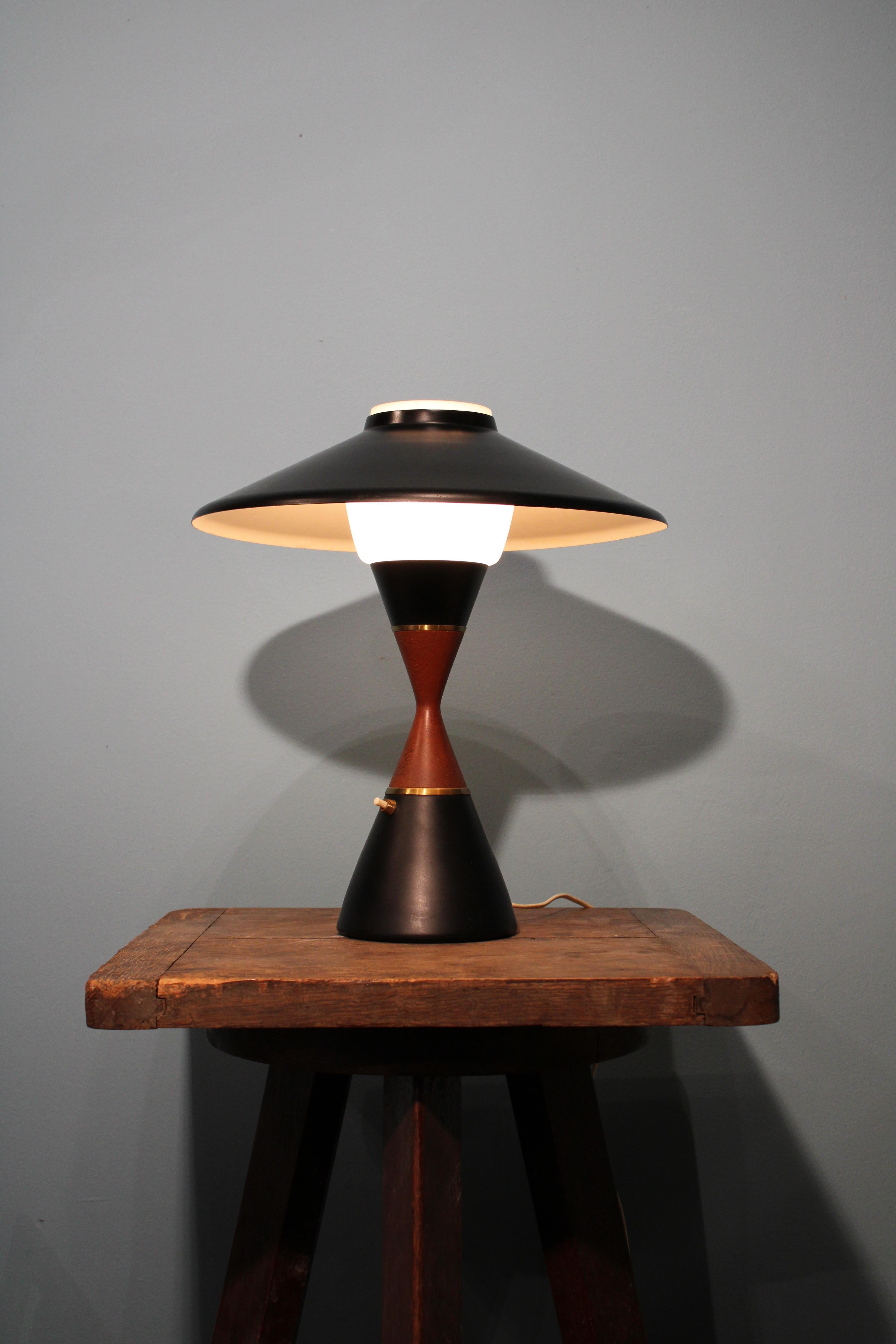 Table lamp by Svend Aage Holm Sorensen, Denmark, circa 1950-1960.
Opaline glass, brass and teak, shade in black lacquered metal.
