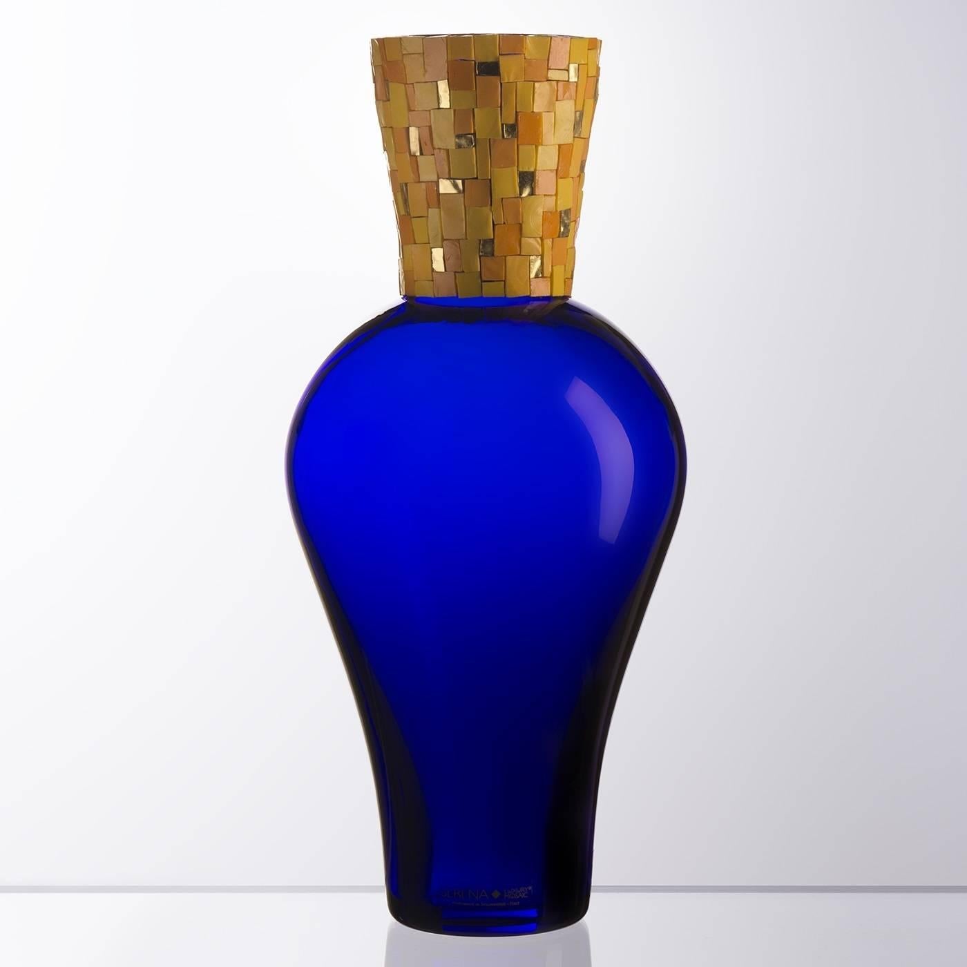 The decorative mosaic accent of this vase is a fine example of the masterful craftsmanship and artistic elegance that is unique to Murano mouth-blown pieces. This striking vase features a sinuous body in an intense blue color that contrasts with the
