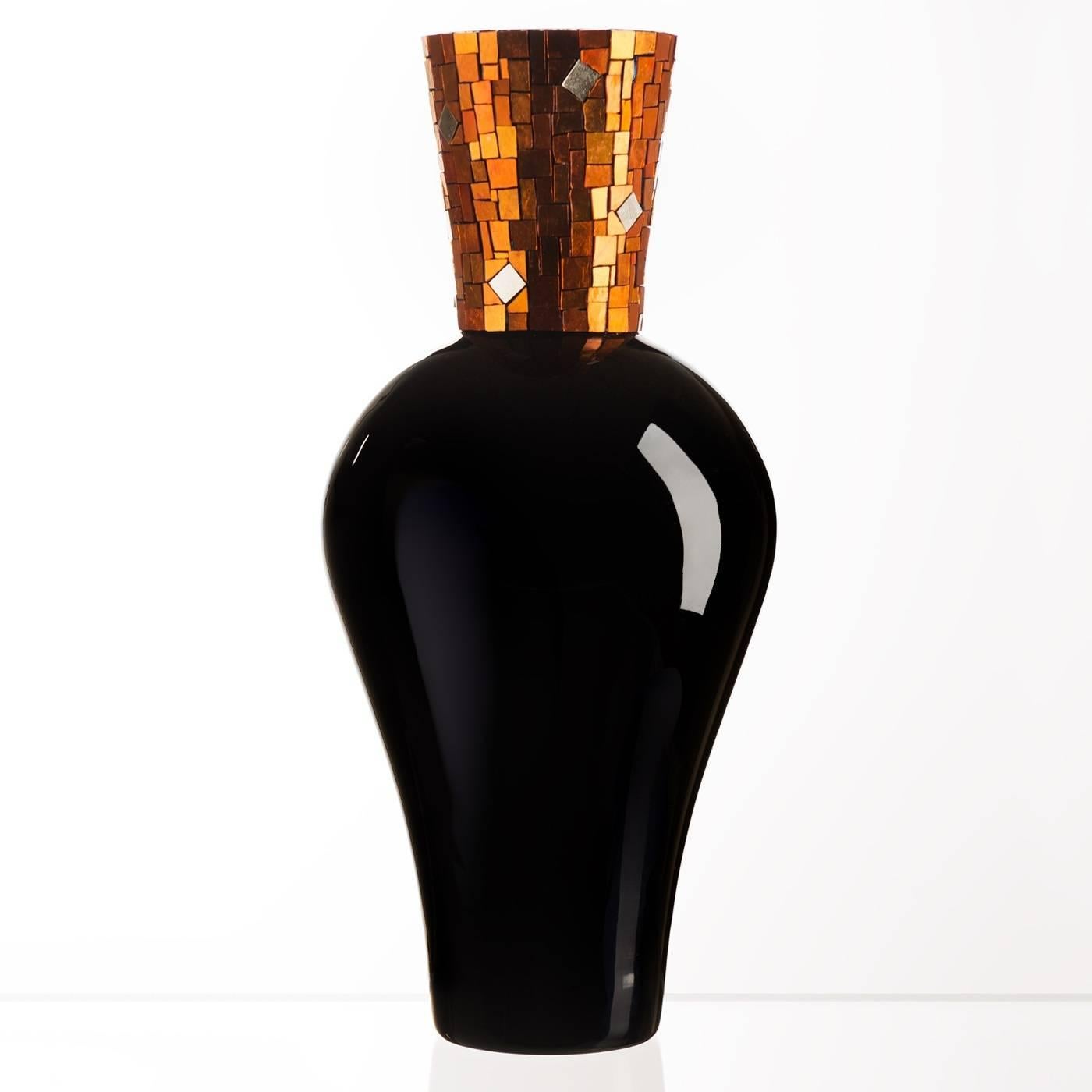 Like all the pieces of the design collection, this captivating vase displays extraordinary craftsmanship. The luxurious mosaic accent that stands atop the black Murano mouth-blown glass is made of 24-karat gold foil and orange glass tesserae,