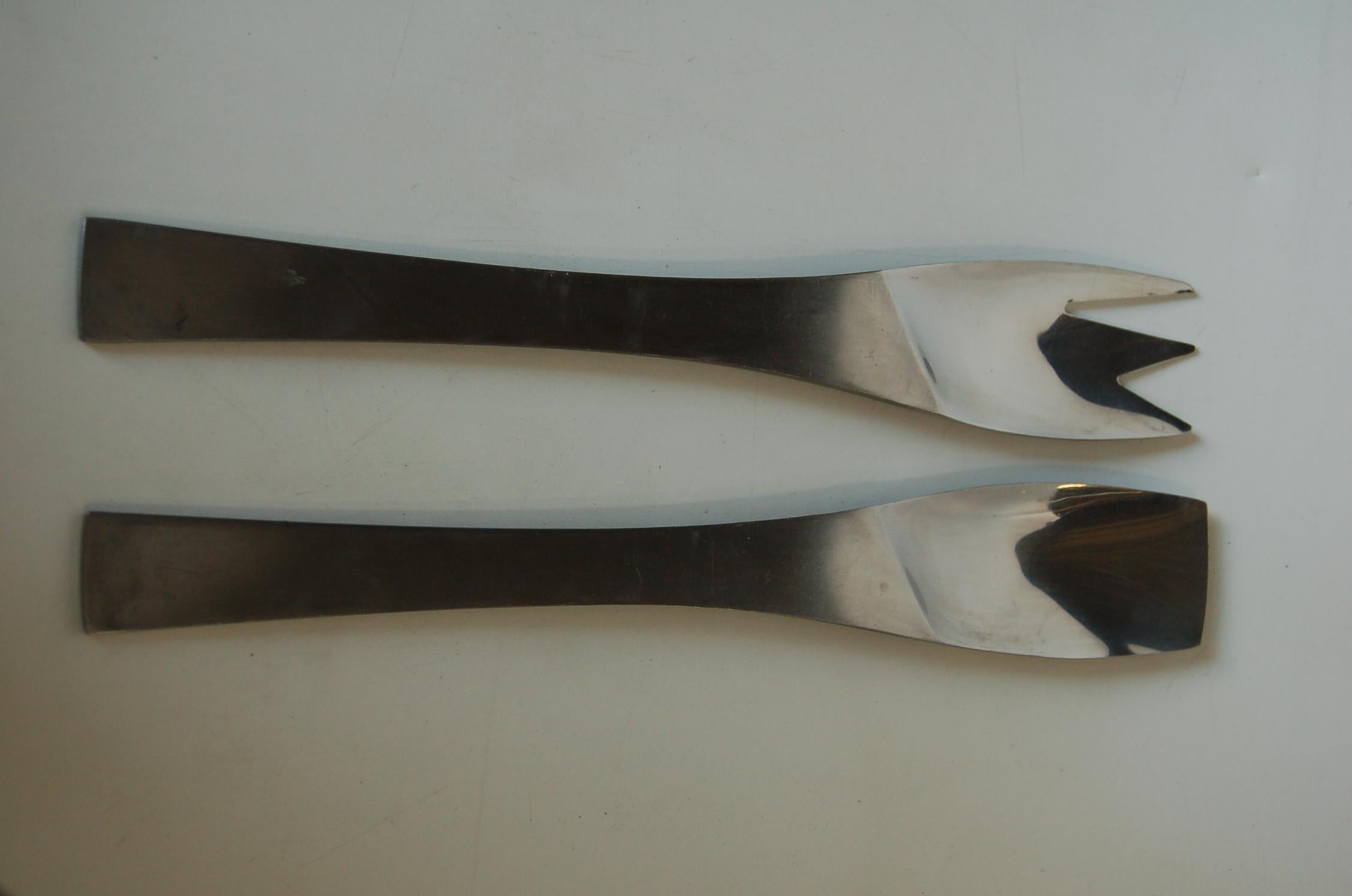 Mid-Century Modern diagonal design stainless steel salad serving utensils set stamped AS Stainless Austria. 

Measures 12