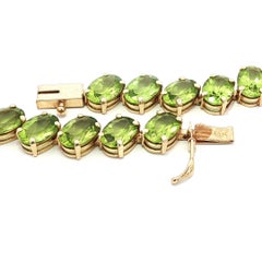 Diagonal Yellow Gold 29ctw Oval Rich Yellowish Green Peridot Tennis Bracelet