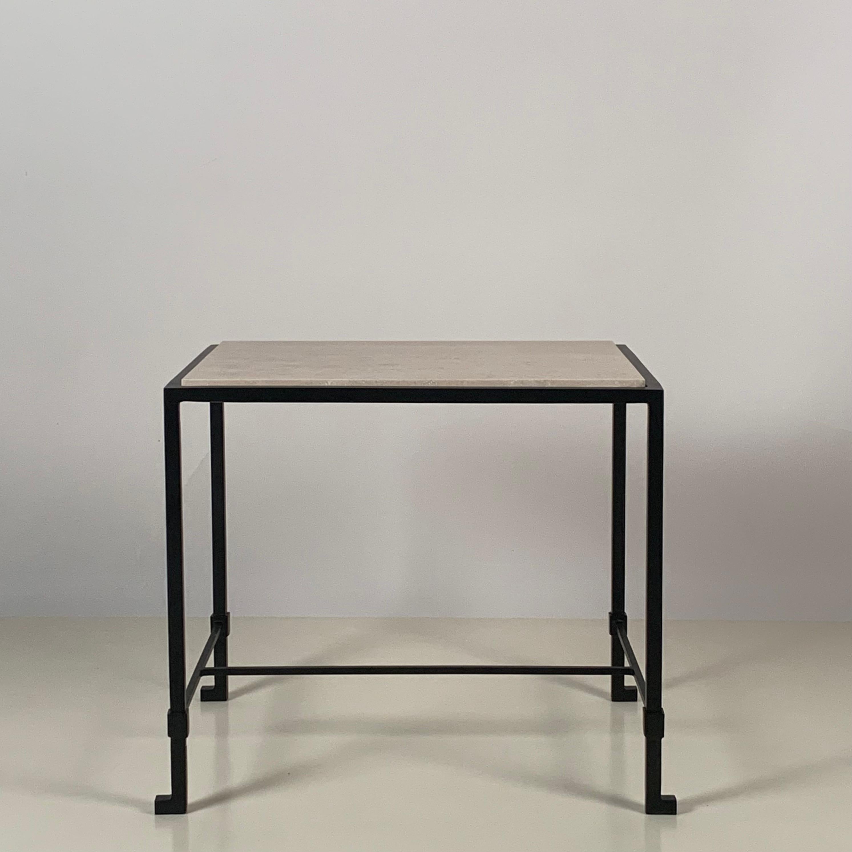 Introducing the 'Diagramme' side or end table by Design Frères, a harmonious blend of timeless elegance and modern sophistication.

The blackened iron base is reminiscent of the iconic Art Deco movement. Its dark finish exudes sophistication and