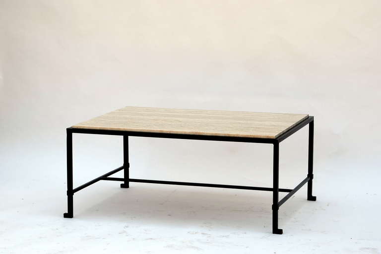 Chic blackened wrought iron and polished raw travertine French 1940s style coffee table. Inspired by the designs of Marc du Plantier and Paul Dupré-Lafon. Great proportions but custom sizes available as well.