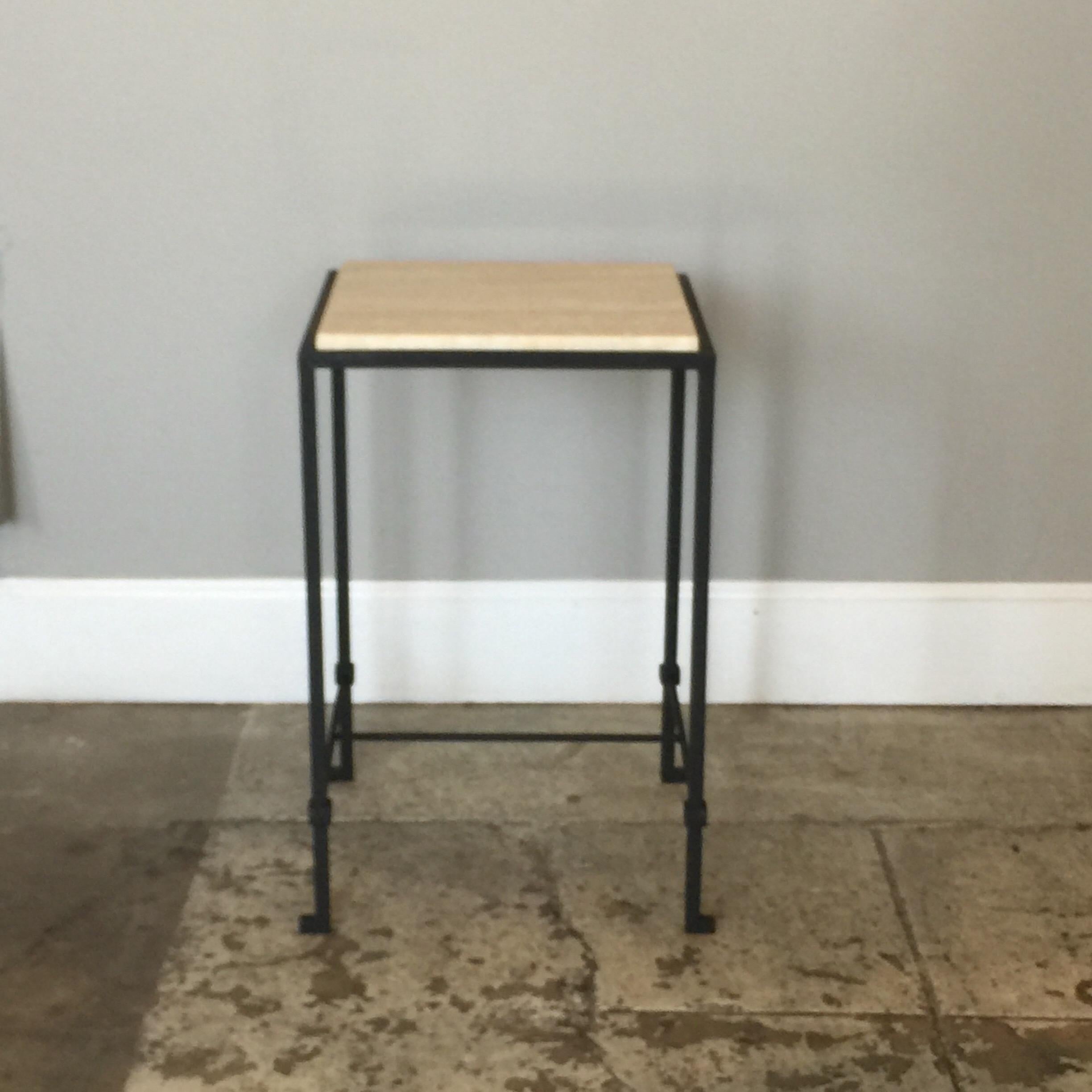 The 'Diagramme' wrought iron and travertine drink table by Design Frères.

Chic blackened wrought iron frame contrasting with cream travertine top insert.

Handmade in our Los Angeles studio.