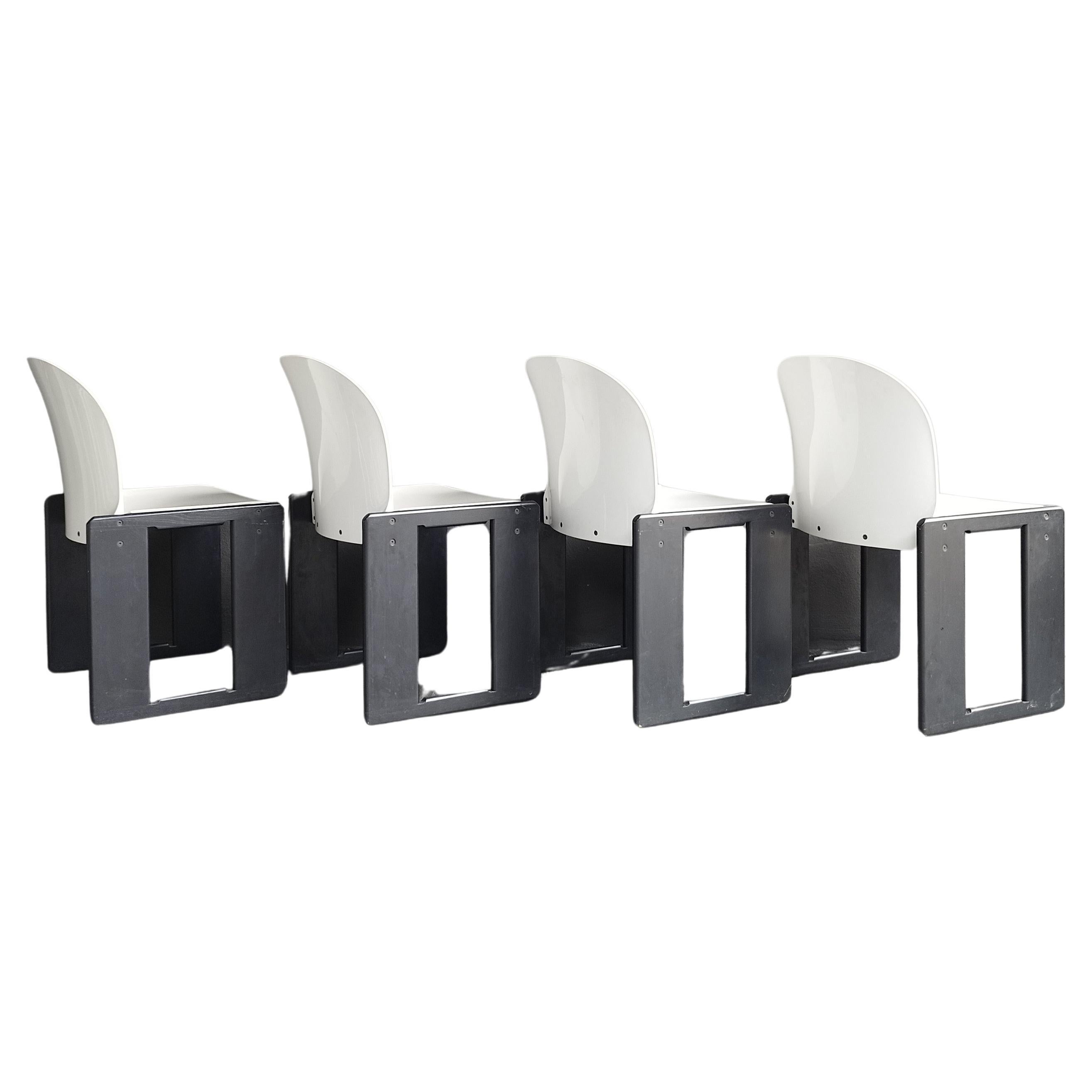 Set of four Dialogo Chairs. Structure in black wood and seats in white plastic. High quality chairs with an unmistakable design, they are perfect for giving warmth, style and elegance to your environment.