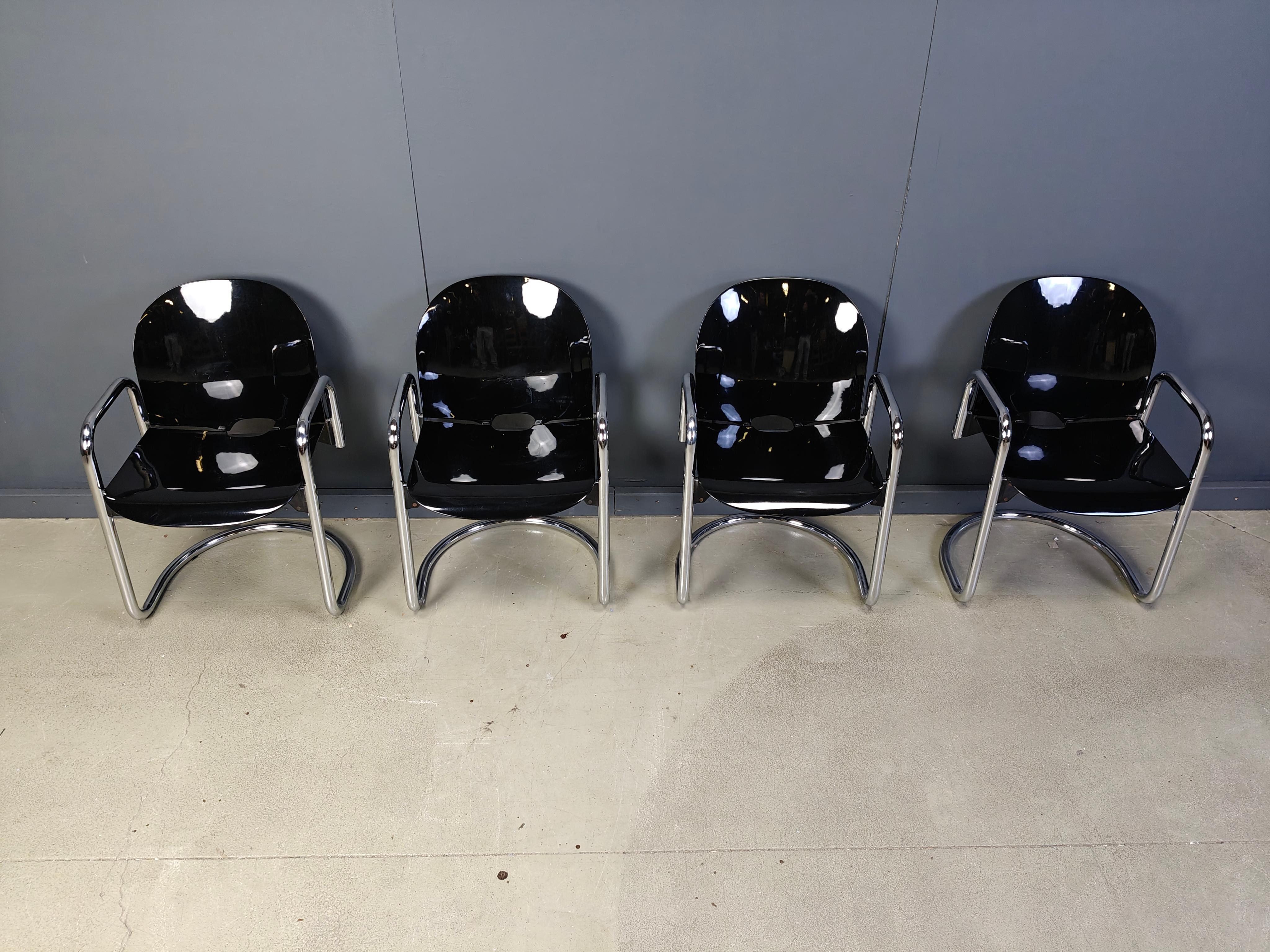 Set of 4  Dialogo dining chairs designed by Tobia & Afra Scarpa for B&B italia.

Black plastic seats with chromed tubular cantilever frame.

Beautiful timeless Italian design.

1970s - Italy 

Good overall condition with normal age related