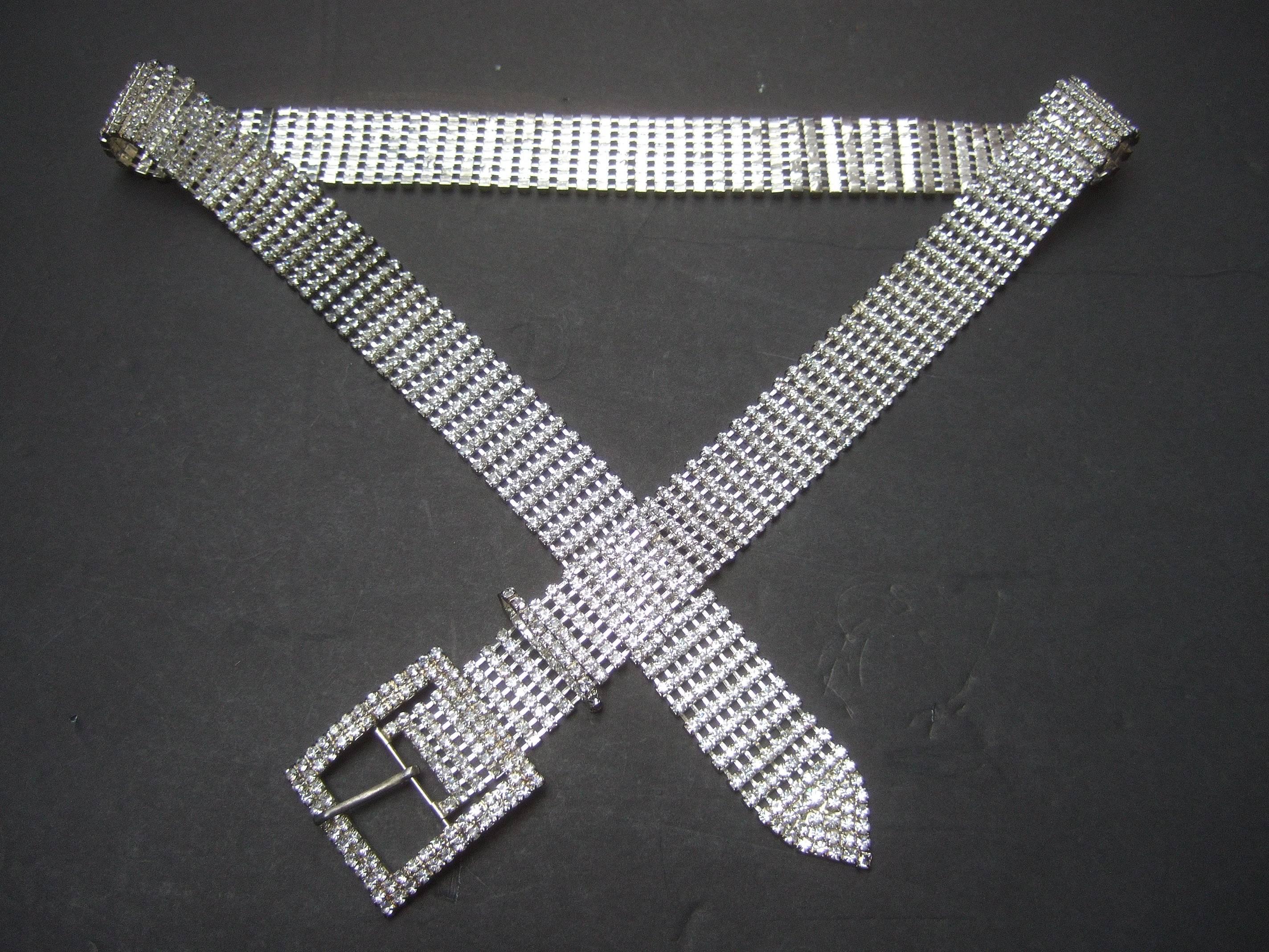 Diamante clear glittering crystal rhinestone link belt c 1960s 
The elegant belt is constructed with rows of clear rhinestone
crystals adhered to a silver rhodium plated metal backing 

The waist crosses over numerous waist sizes up to 38 inches
Can