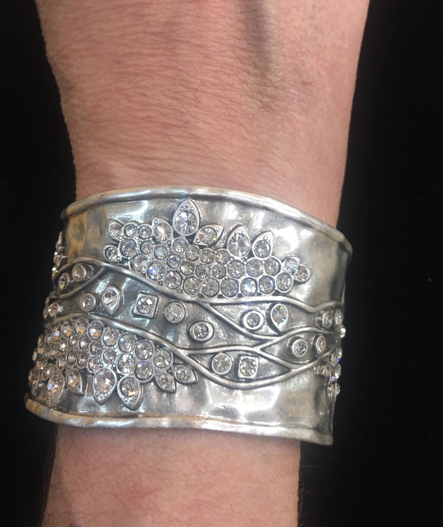 Stunning Sparkling Crystal Hinged Cuff Bracelet. Front and back set with Sparkling Crystals in eye catching abstract design. Silver tone mounting. The camera didn't capture the beautiful Sparkle. So much More Beautiful in real time! Add pizazz to
