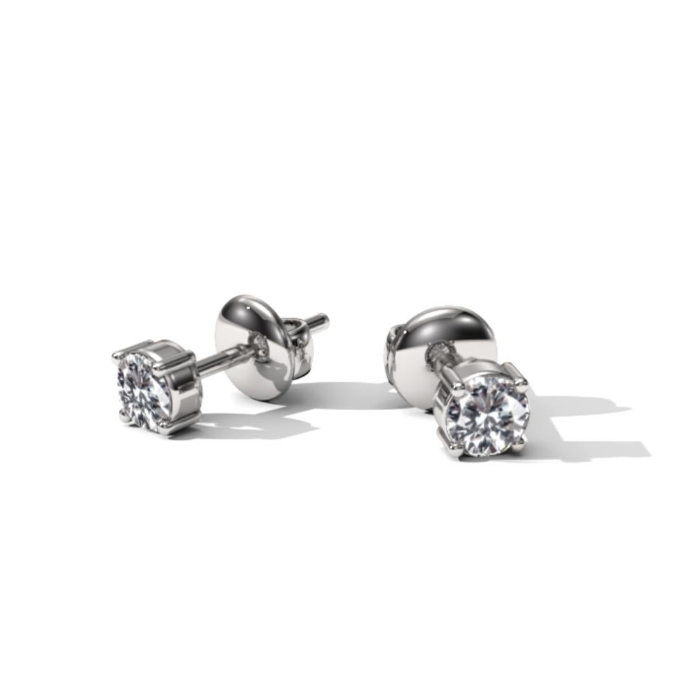 Made to order pair of earrings in 14k white gold with 3mm diamonds (in diameter).
These timeless earrings feature 3mm brilliant cut diamonds held in a four prong setting, ensuring both elegance and durability. Their push-back closure guarantees
