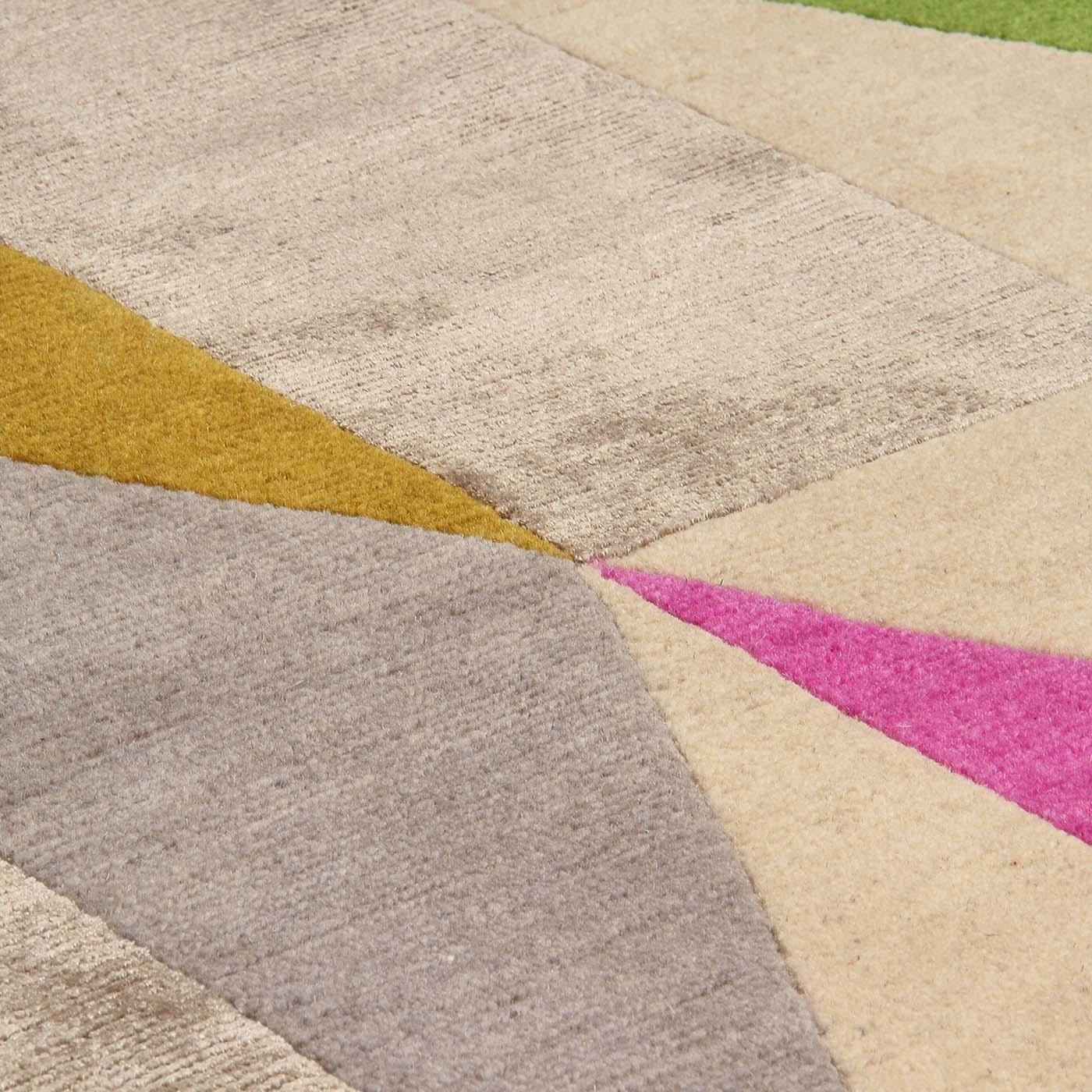 A sequence of triangles that turn into diamonds, thence to squares and rectangles displaying soft hues and slender shapes embellished with powerful colorful accents. From the original design of Gio Ponti, this Diamantina carpet's decoration
