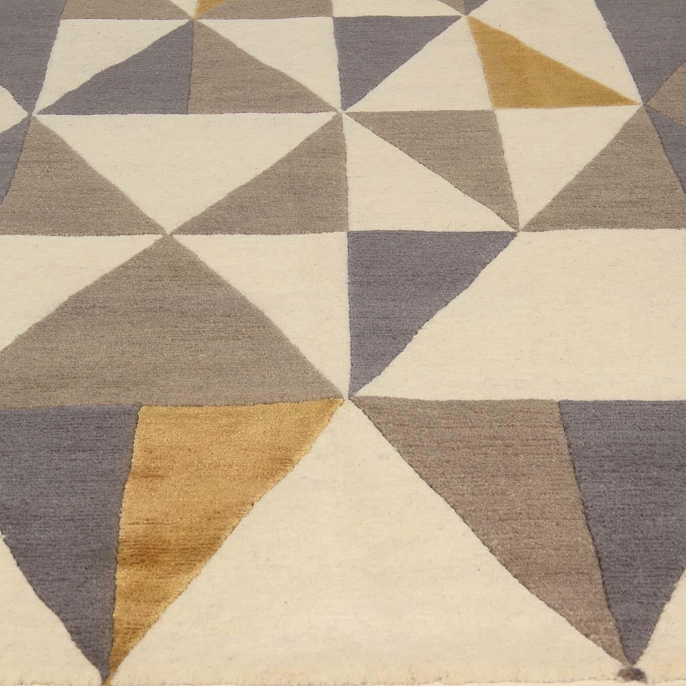 A sequence of triangles that turn into diamonds, thence to squares and rectangles displaying soft hues and slender shapes embellished with powerful colorful accents. From the original design of Gio Ponti, this Diamantina carpet's decoration