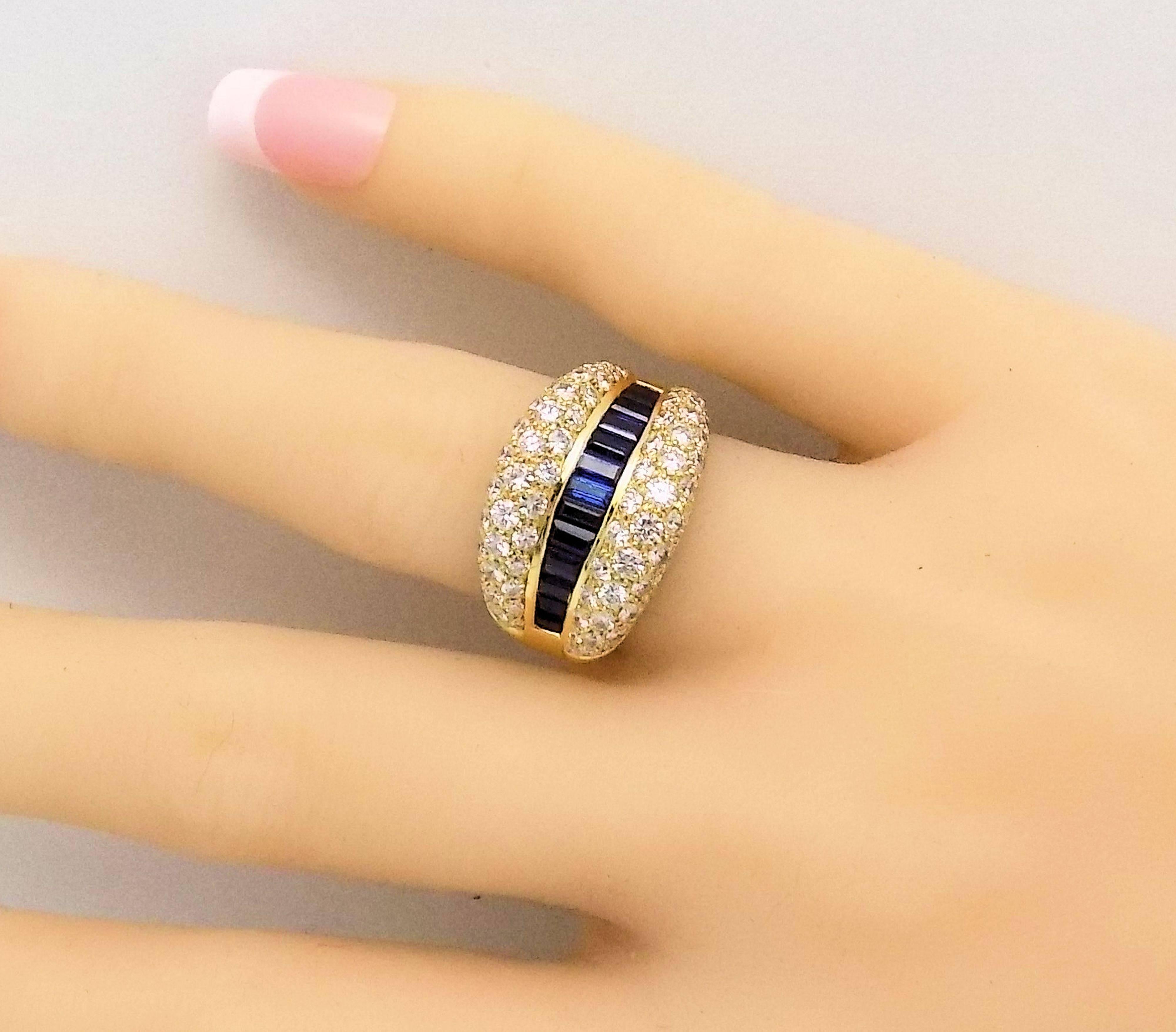 18 Karat Yellow Gold Ring with 88 Round Brilliant Diamonds, Pavé Set, 2.01 Carat Total Weight, VVS-2, H with Center Row of 13 Baguette Fine Sapphires, 1.41 Carat Total Weight. Finger Size:  6.25. Stamped: 750, 18K. 9.1 DWT or 14.15 Grams.