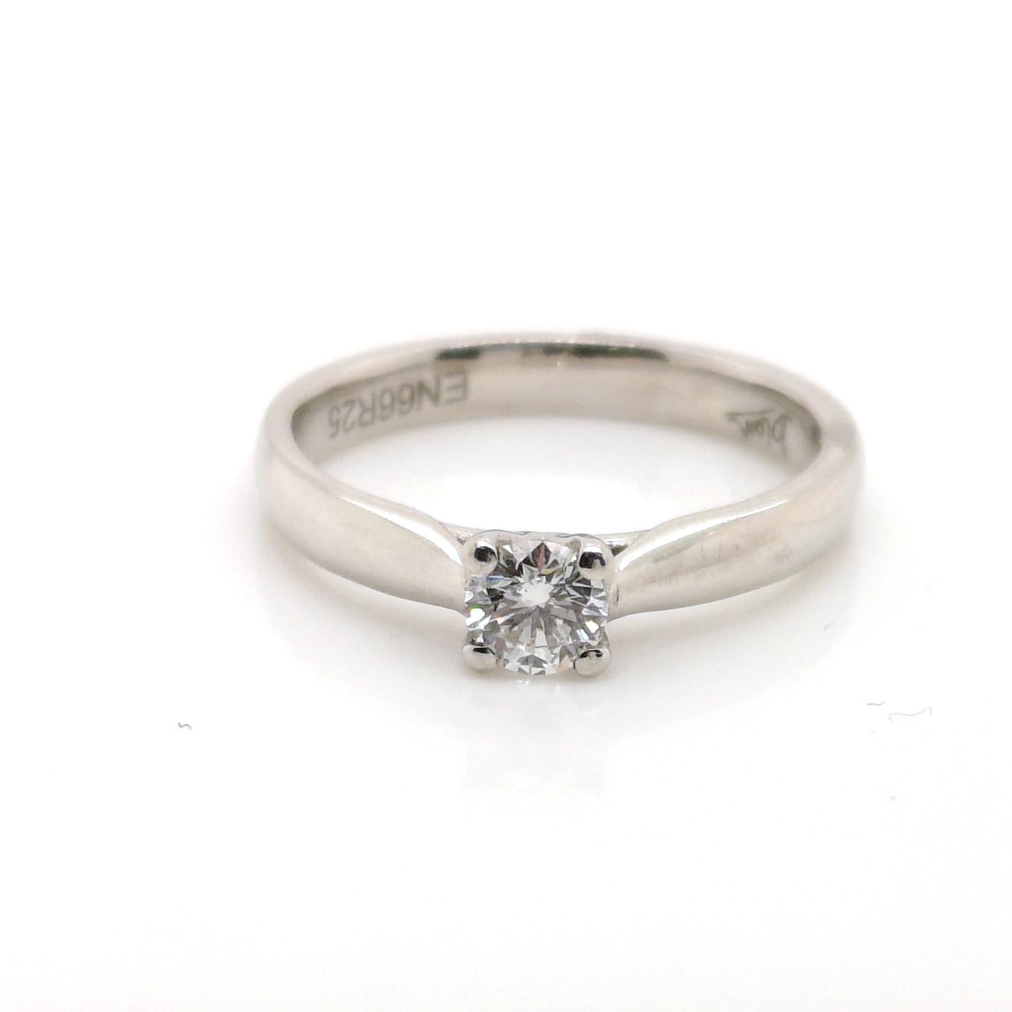 A diamond engagement ring, single stone, round brilliant-cut diamond, weighing 0.25ct, in a ffour claw setting, with a 2.5mm wide tapering shank, mounted in platinum.