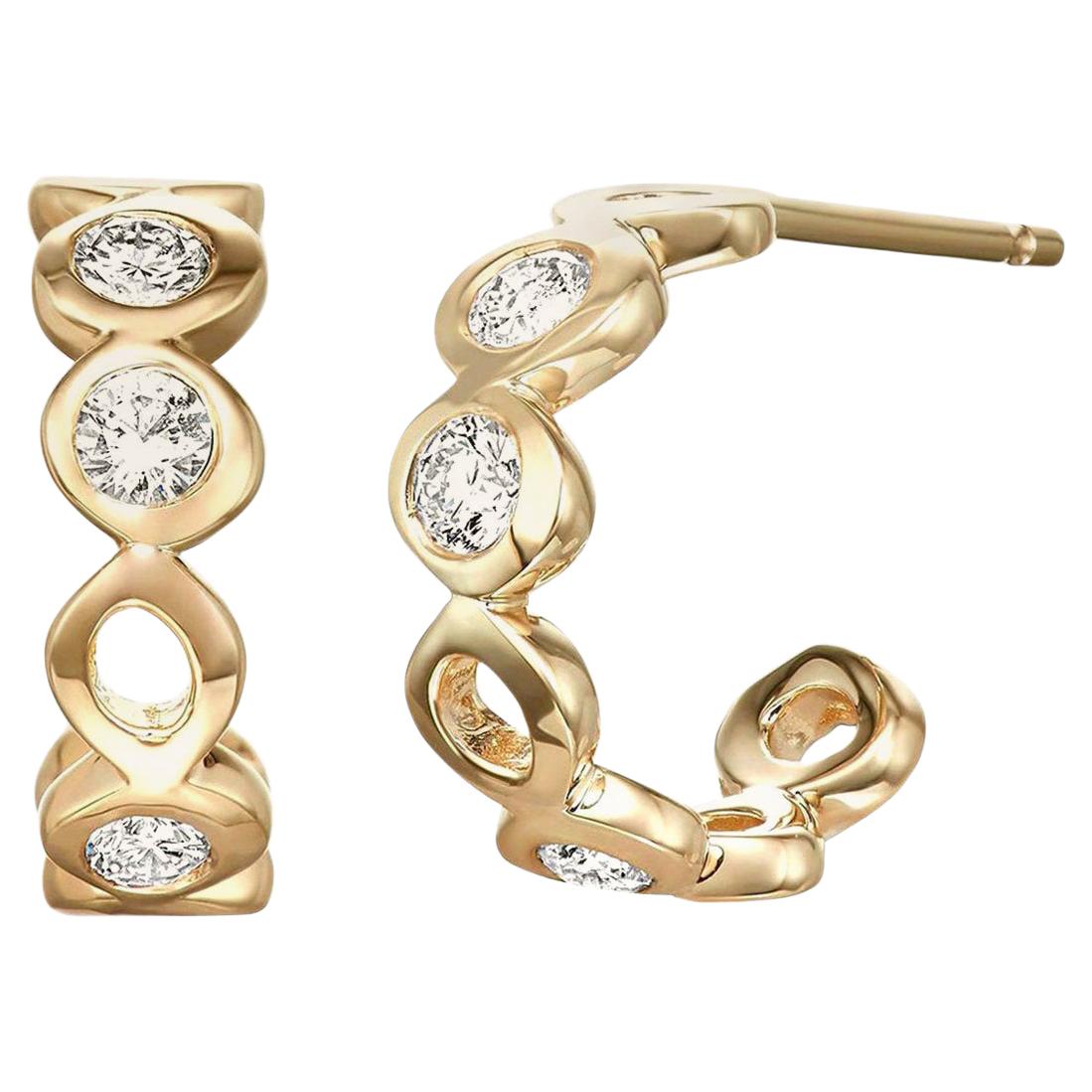 Boucles d'oreilles huggies en or jaune 14 carats avec diamants 0,32 carat en vente