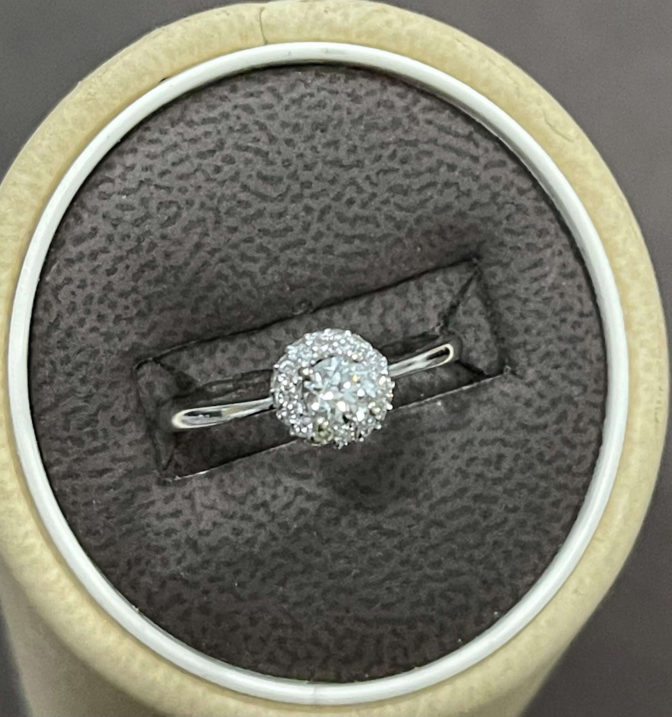  Diamond 0.5 Carat Traditional Ring/Band 14 Karat White Gold, Halo Ring
one 25 pointer  Brilliant cut round diamonds  surrounded by small diamond halo ring around the center diamond.
Center stone is approximately 25 pointer while the side diamonds