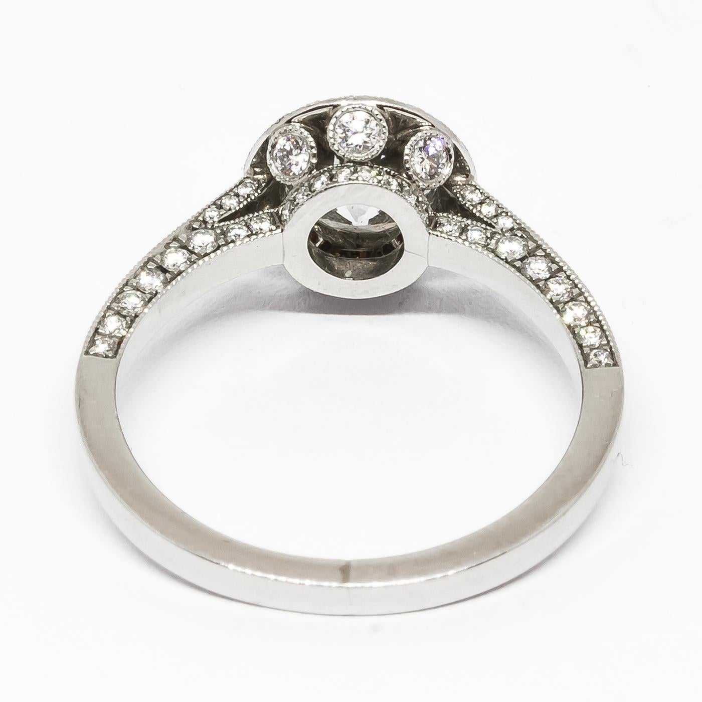 Modern Diamond and Platinum Micro Pavé Halo Ring, 0.94 Carats For Sale 1