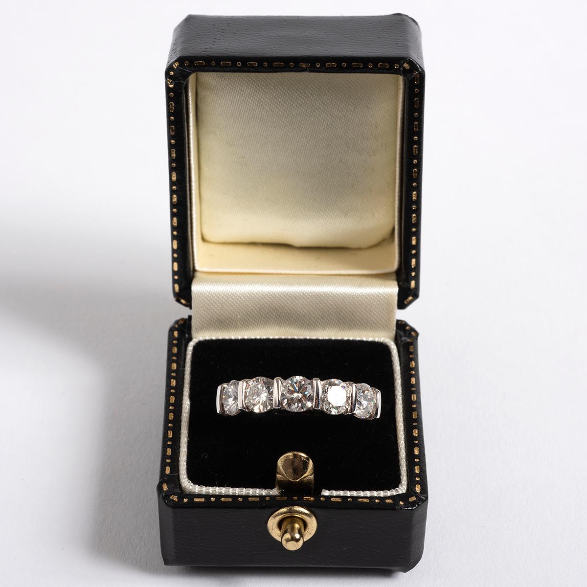 A unique piece within our carefully curated Vintage & Prestige jewellery collection, we are delighted to present the following:

Our diamond 1/2 eternity ring has an 18k yellow gold band with 18k white gold mount, and is set with 5 brilliant cut