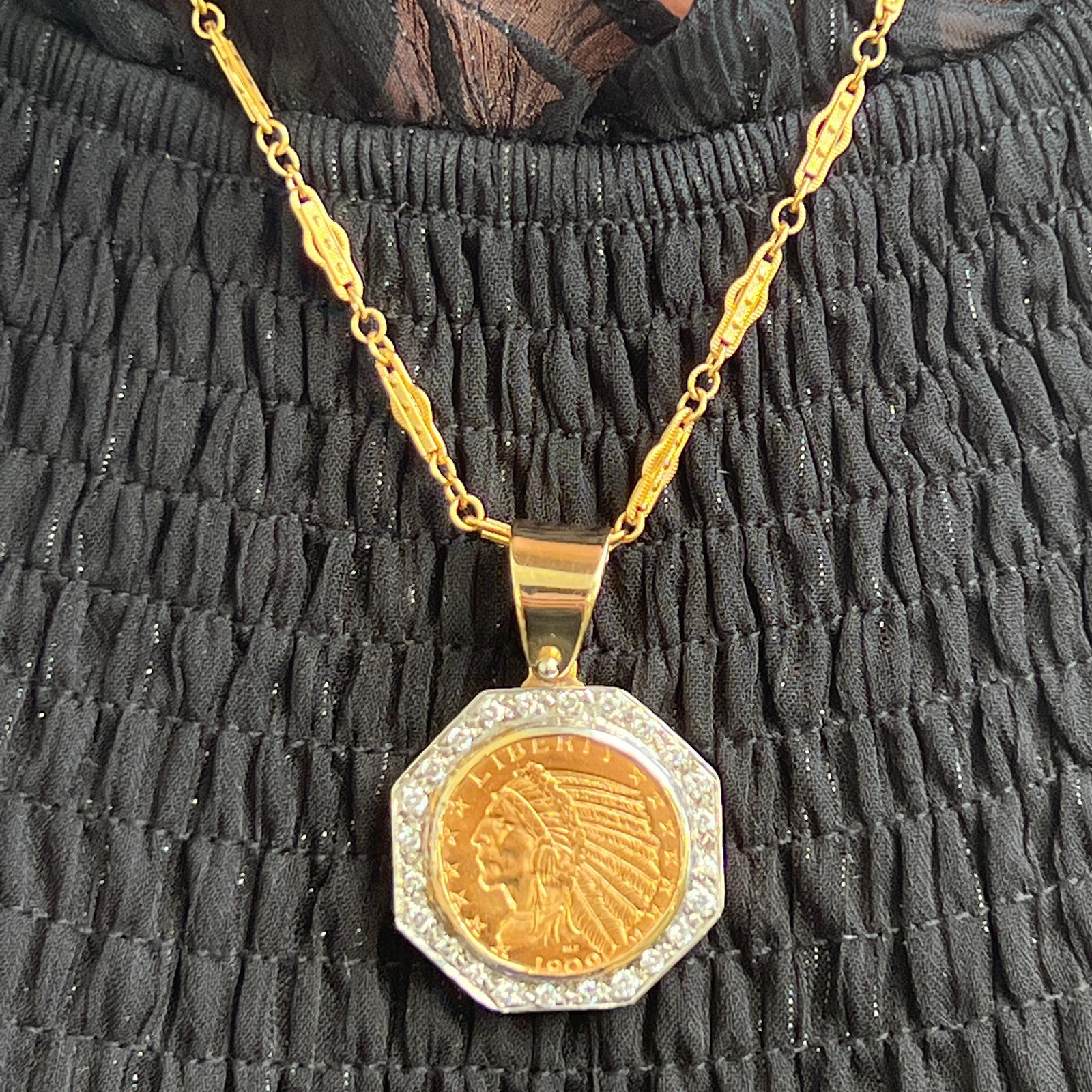 Diamond frame coin pendant crafted in 14 karat yellow gold. The original $10 Indian Head Coin (90% gold) is held in an octagonal diamond frame. The 24 round briliant cut diamonds weigh approximately 1.10 CTW. The pendant measures 1.60 inches in