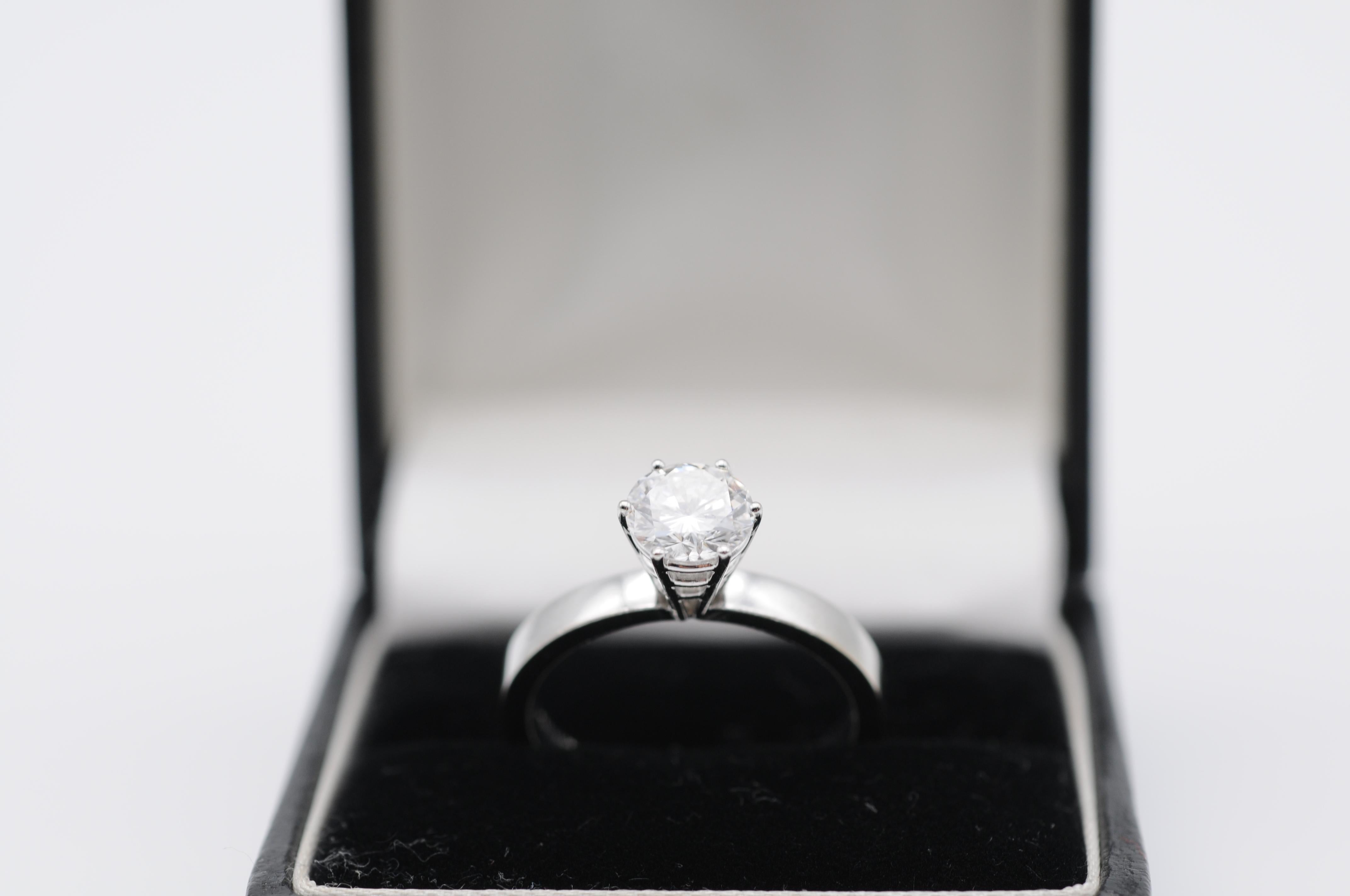 Diamond Details:

Clarity: VVS1 (Very Very Slightly Included, with minute inclusions only visible under 10x magnification)
Color: G (Near Colorless)
Carat: 1.05
Cut: Good
Shape: Brilliant Round
Additional Characteristics:

Fluorescence: None
Girdle: