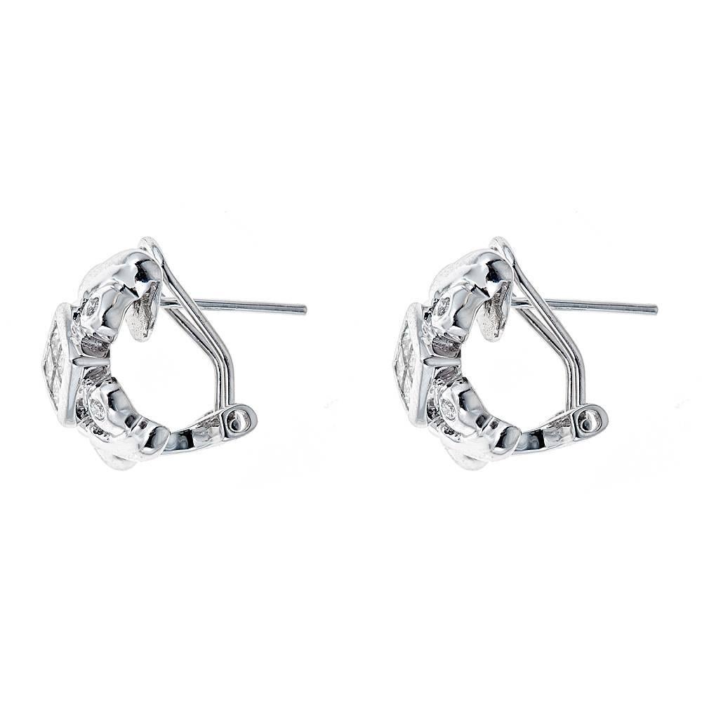 14k white gold earrings with approximately .73 CT in princess cut and round diamonds (GH color, SI-SI2 clarity)