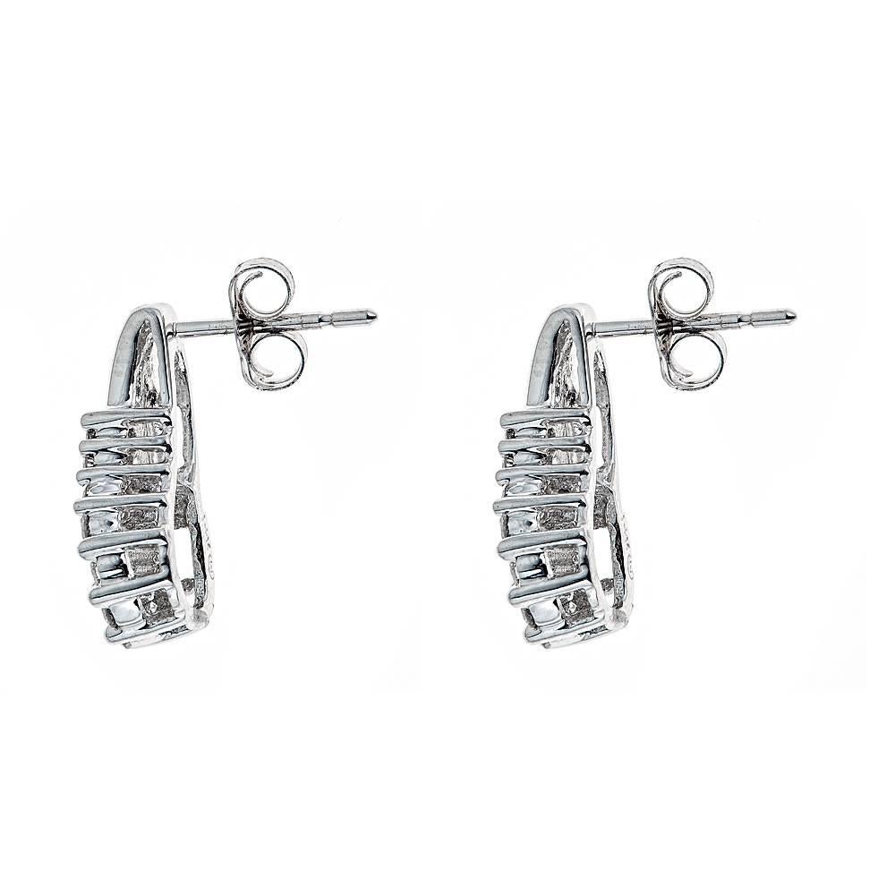 Beautiful earrings set in 14k white gold with approximately .50 CT in round diamonds.