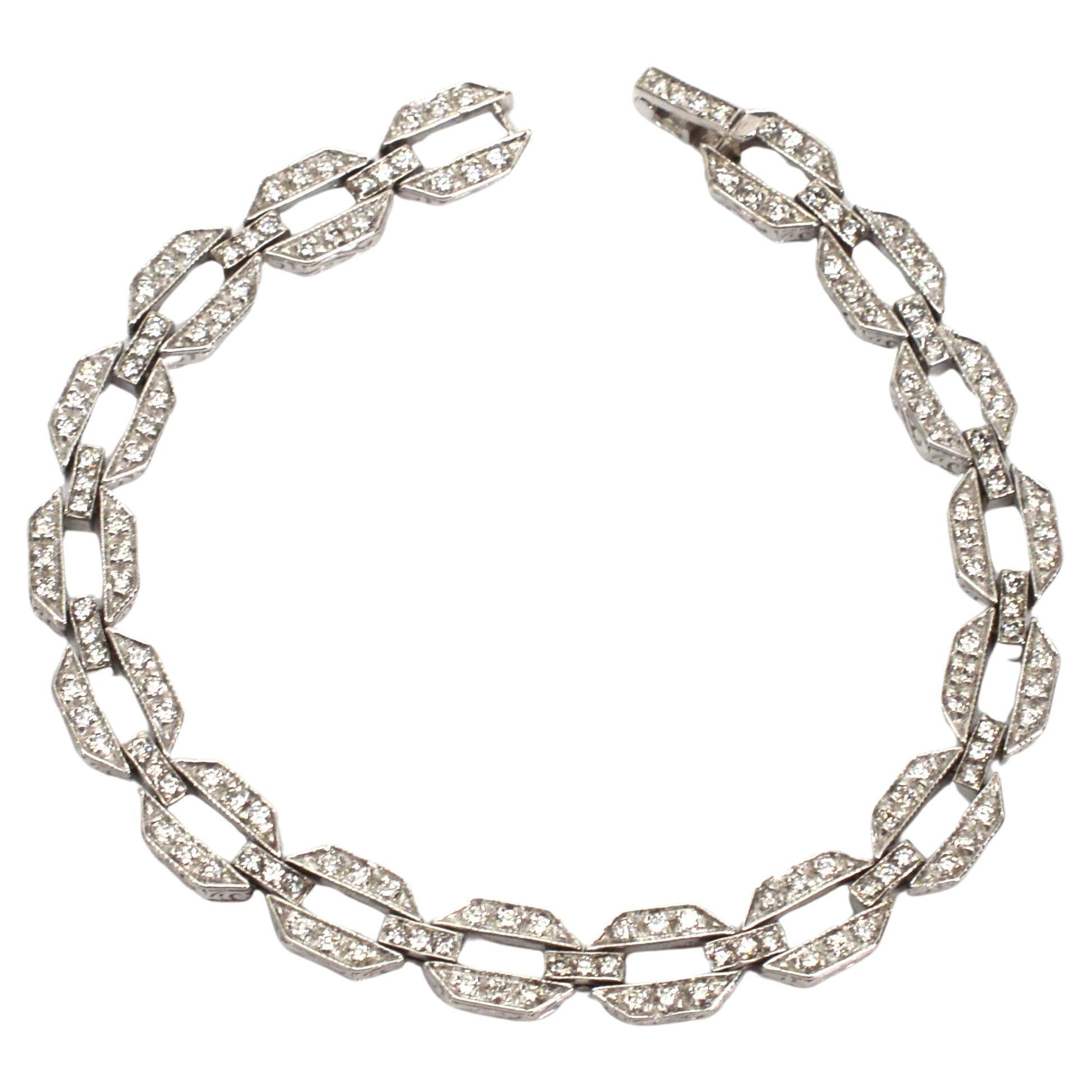 Over one-half carat of sparkling individual bead set diamonds light up this 14 karat white gold hexagon link bracelet and create a stunning look with Art Deco style elegance. Geometric shapes, clean lines and a sense of symmetry have timeless appeal