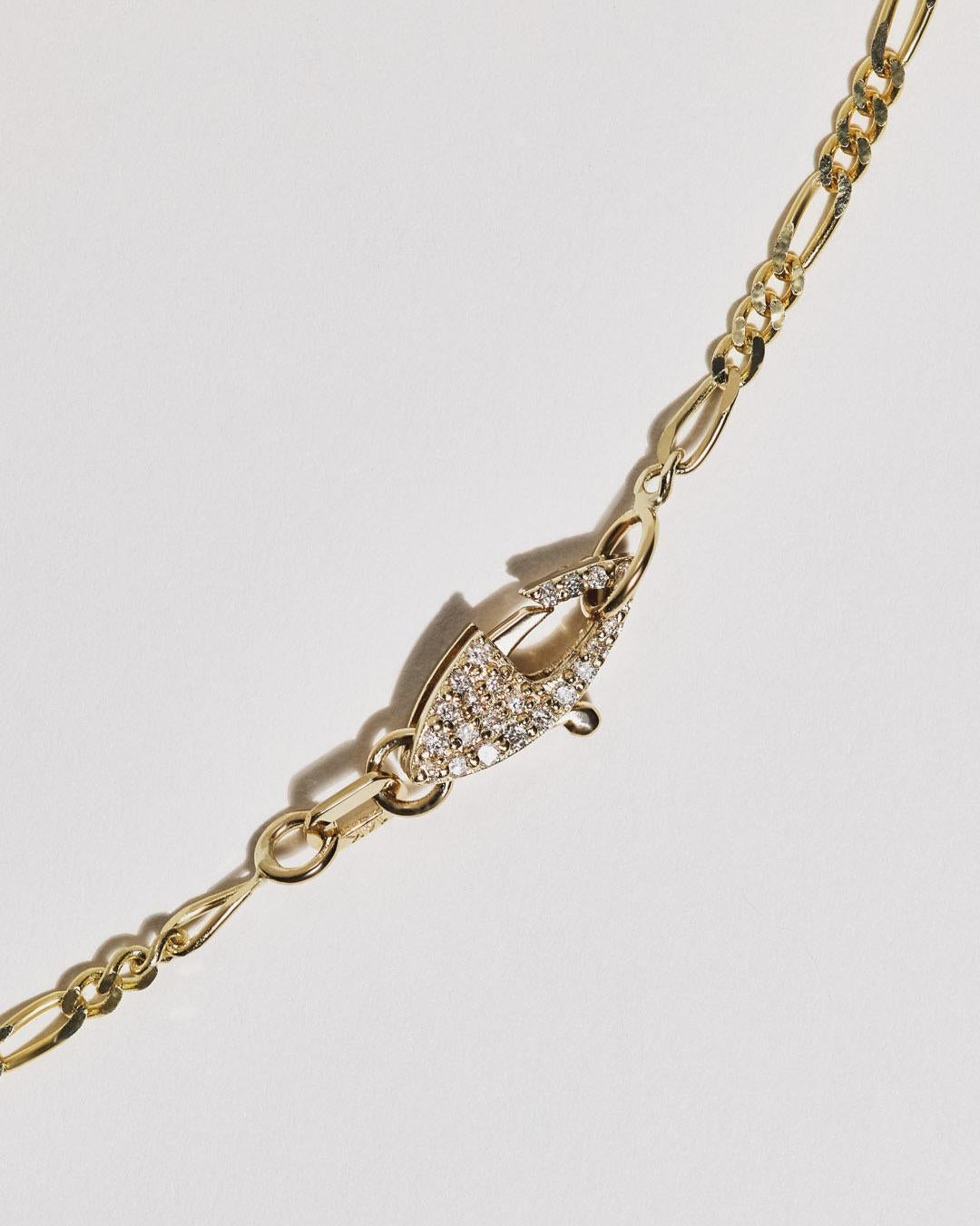 Series of Eleven Diamond Clasp 14k Gold Figaro Chain Necklace In New Condition For Sale In Manhattan Beach, CA