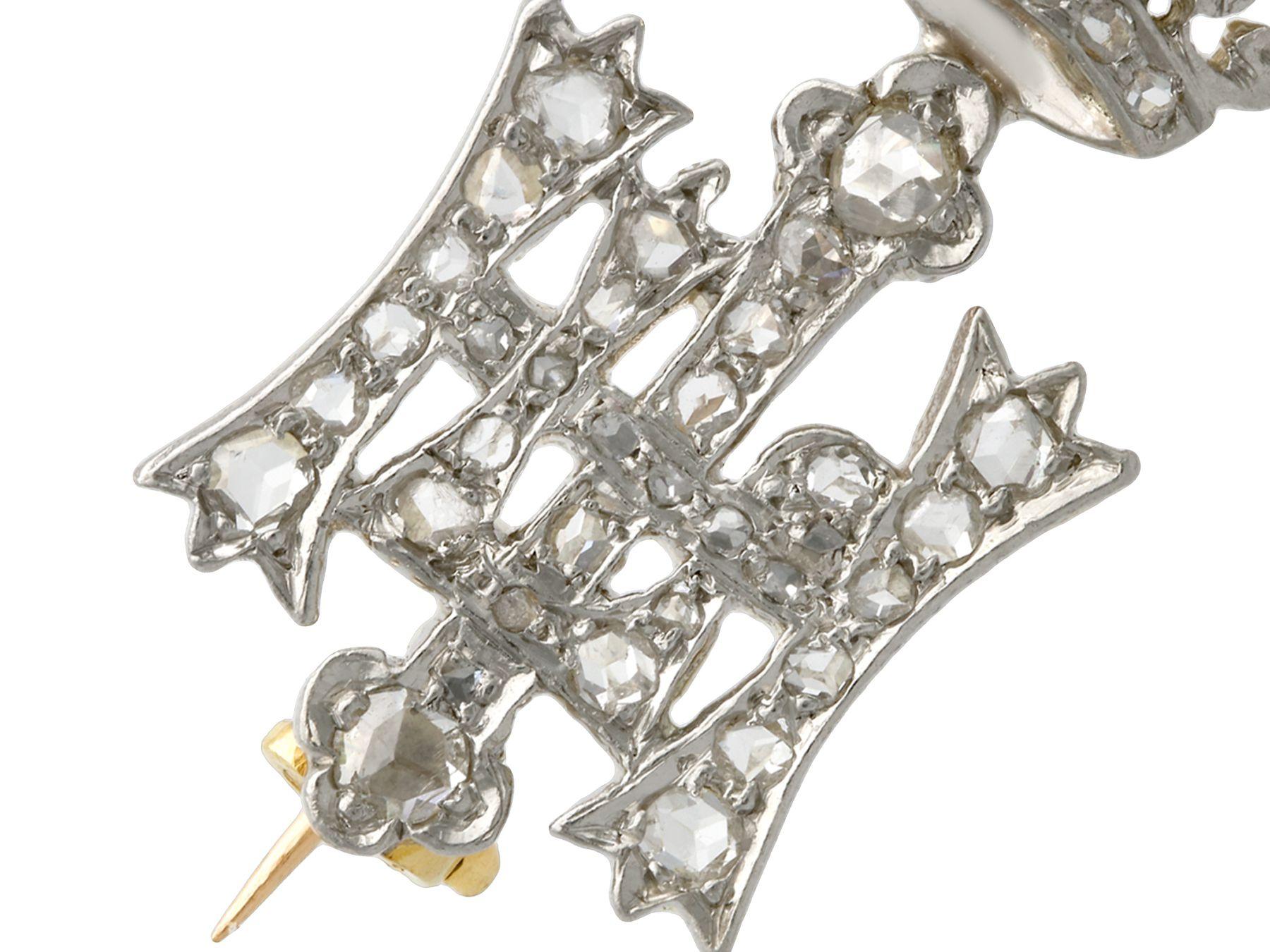 A fine and impressive 0.28 carat diamond, 14k white gold and palladium set Highland Light Infantry sweetheart brooch; part of our diverse antique estate jewelry collections.

This fine and impressive antique pin / brooch has been crafted in 14k