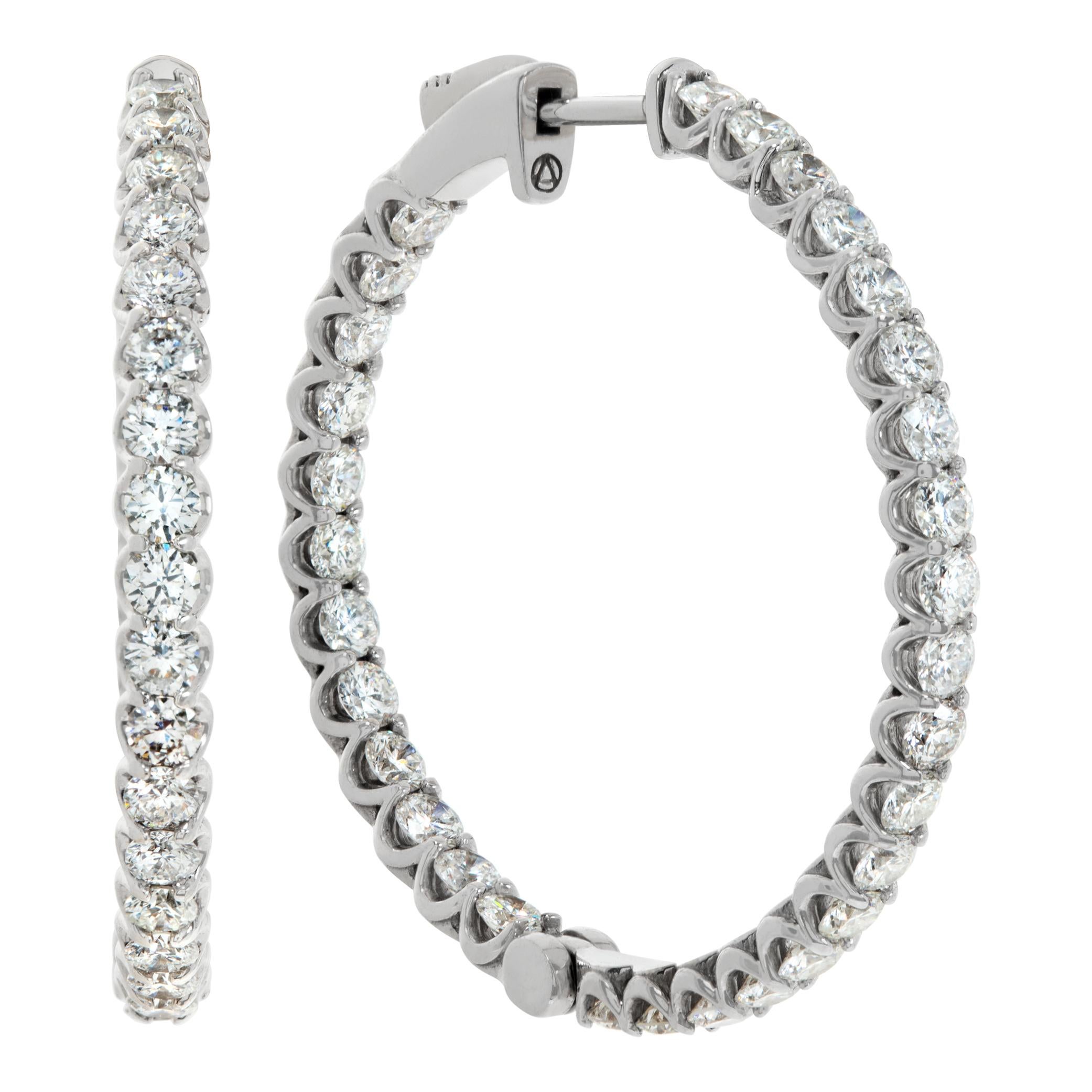 Inside-out diamond hoops earrings set in 14k white gold. Round brilliant cut diamonds total approx. weight: 3.96 carats, estimate: G-H color, SI clarity. Hanging length 1.26 inches.
