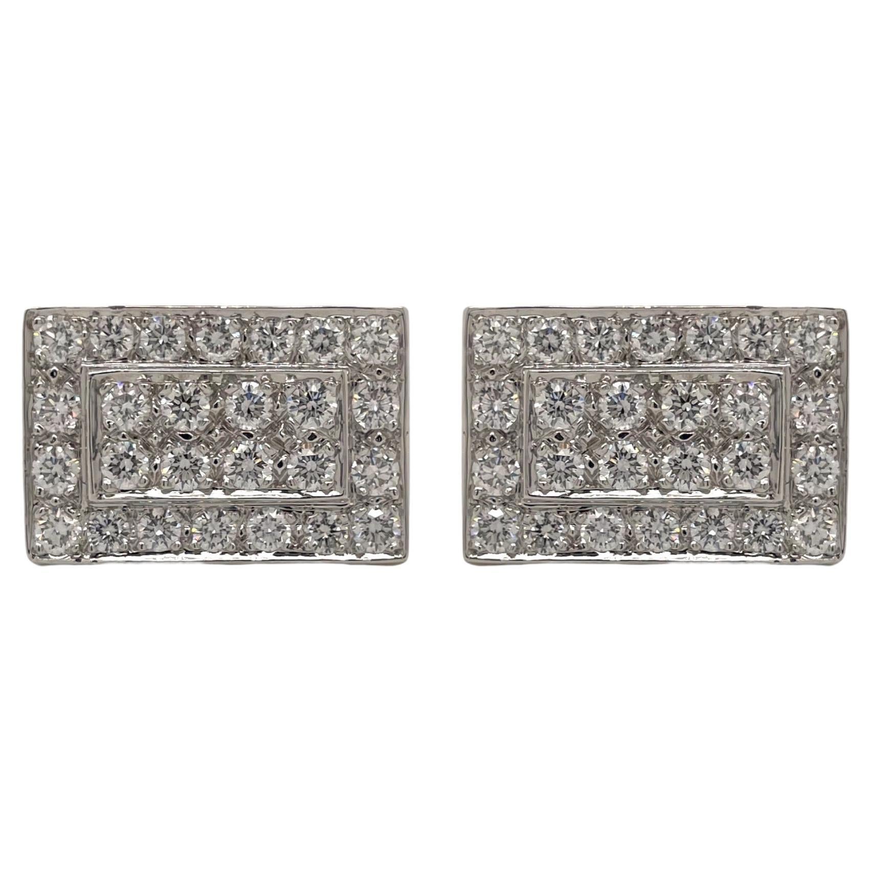 One pair of diamond and 14k  white gold rectangular cufflinks. 
Cufflinks contain 96 round brilliant diamonds, 2.25tcw. Diamonds are colorless and VS2 in clarity. Cufflink measure approximately 19x13mm and weighs a total of 14.3g.

All of our pieces