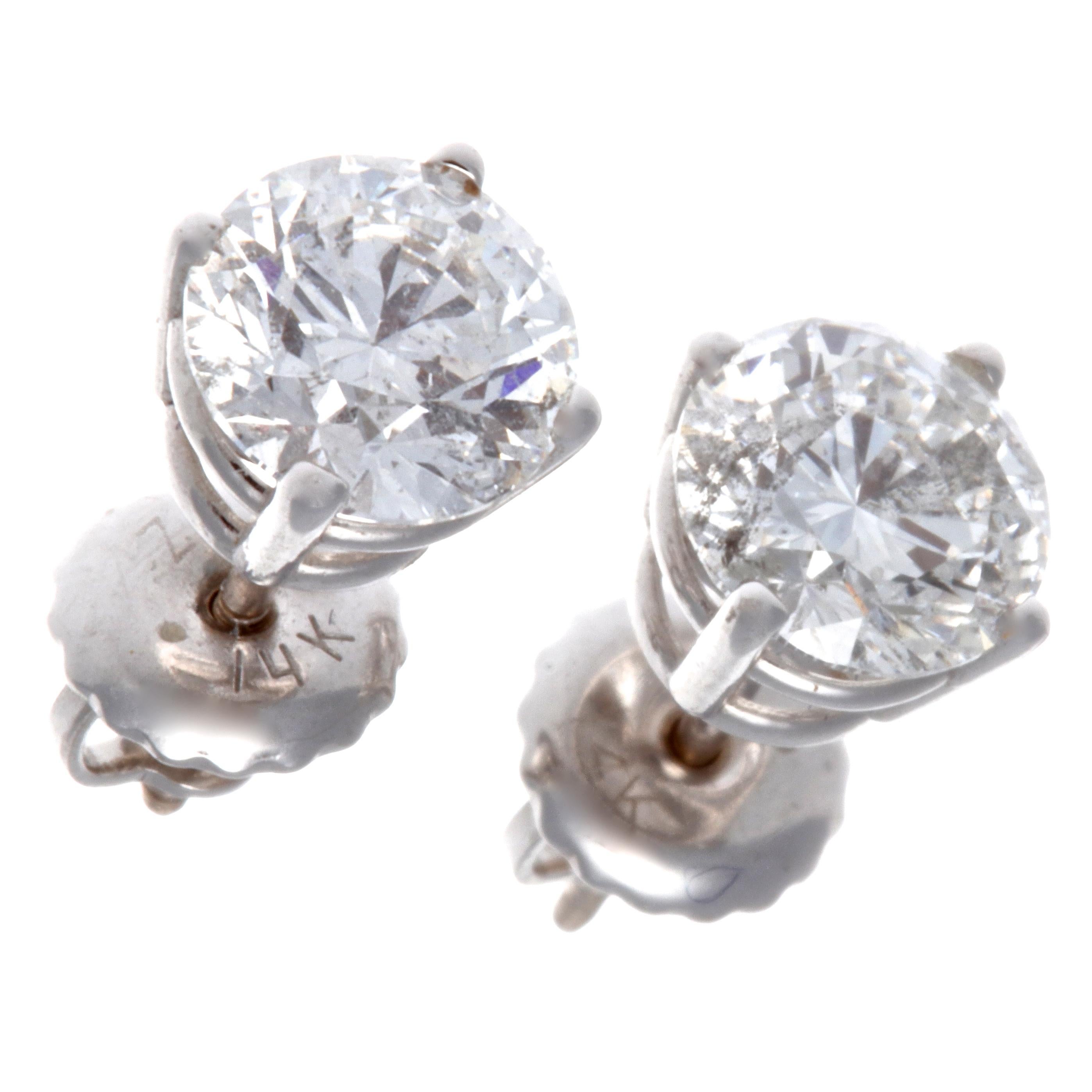 Looking for the perfect studs? These are perfect; bright, very white diamonds, timeless, classic and sparkling. The round cut diamonds weigh a total of 1.60 carats, F-G color, I1 clarity. In 14K white gold. 

Flawless Protection Plan
-7-day return