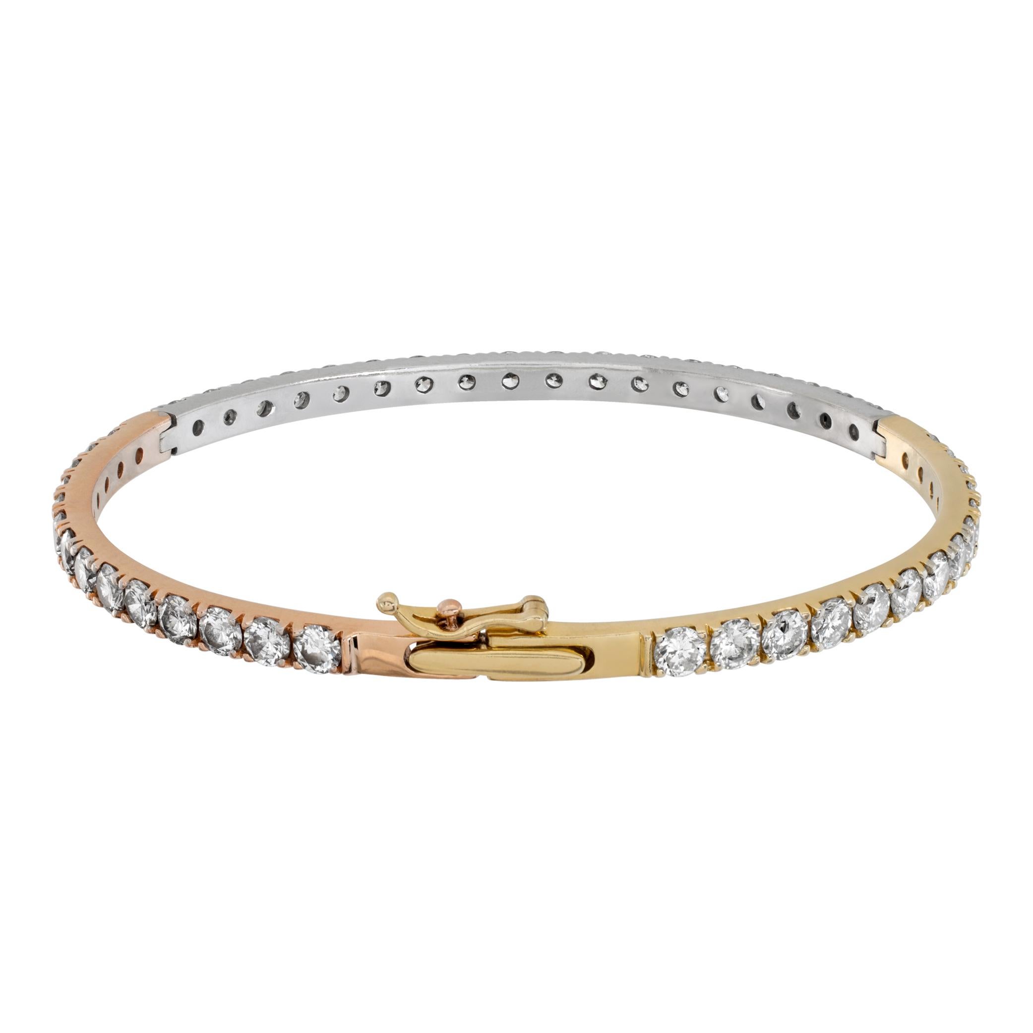 Round brilliant cut diamond bangle bracelet in 14k white, rose and yellow gold. Round brilliant cut diamonds total approx. weight: over 5.50 carats, estimate G-H color, VS-SI clarity. 1/8 inch wide. Will fit up to a 6.75 inch wrist.