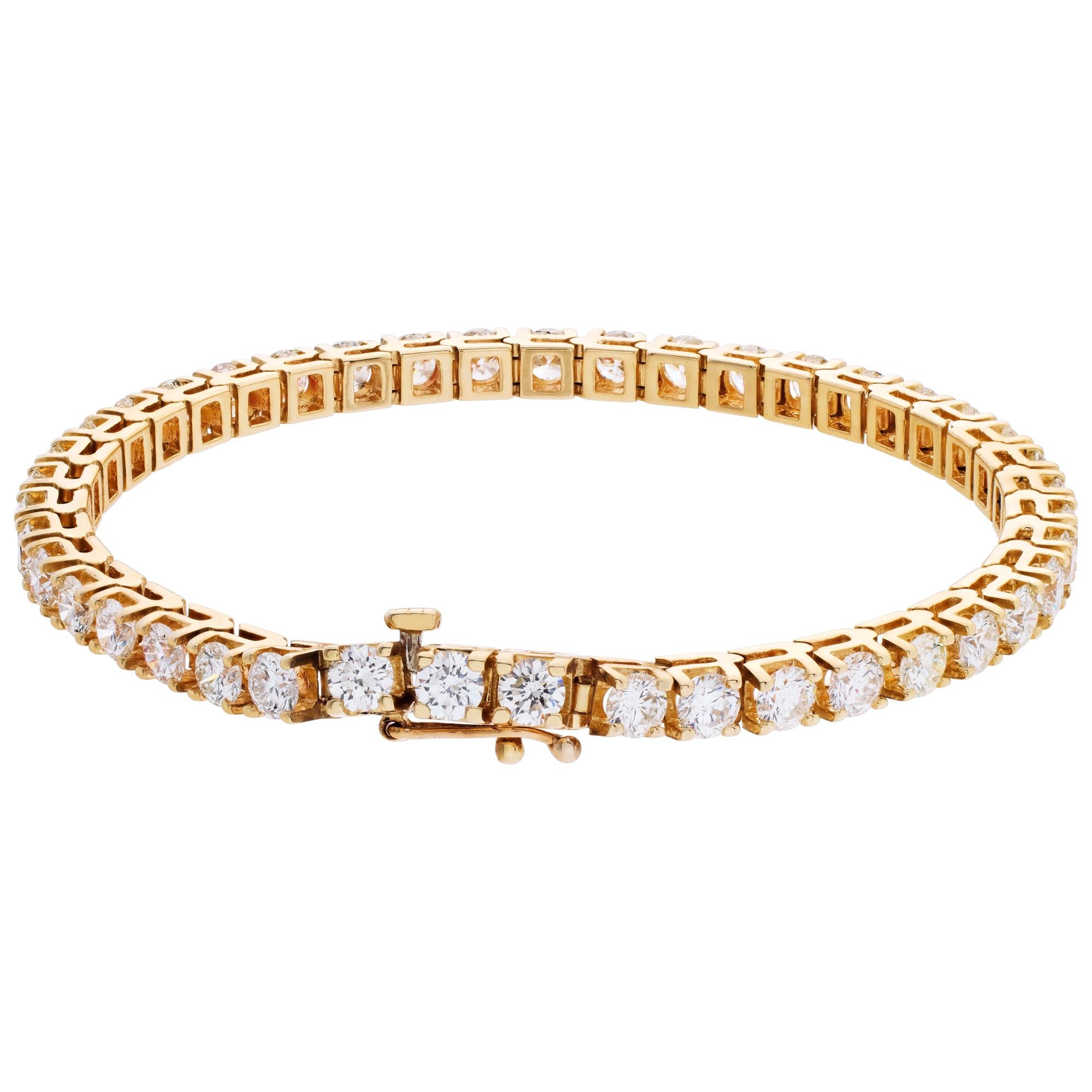 Diamonds line bracelet with approx 8 carats round brilliant cut diamonds, set in 14k yellow gold. Diamonds estimate: H-I color, SI clarity. Length 7 1/4