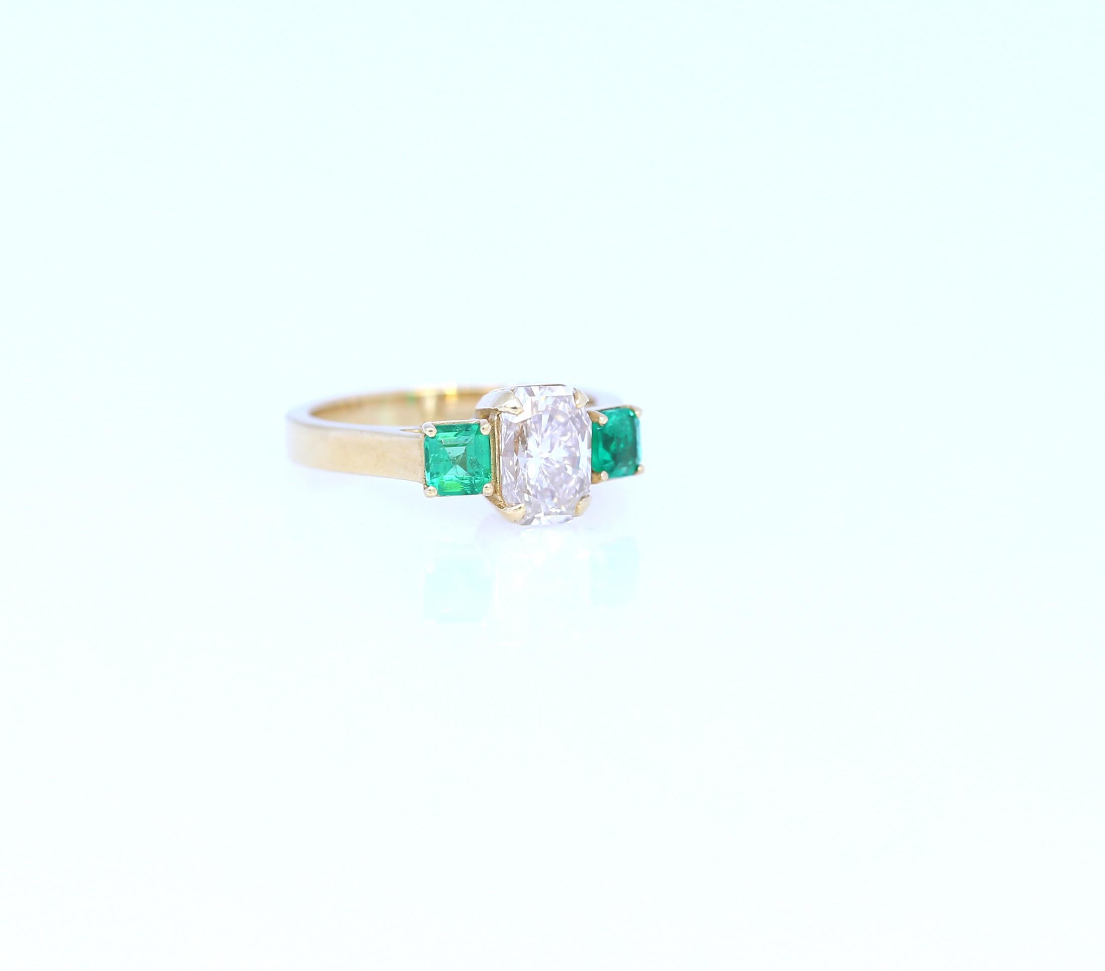 Engagement Ring 1.59Ct with Fine Diamond VVS Emerald-cut. Two Emeralds square cut of Columbian origin clean and fine colour.
Stamped 18K Yellow Gold. 2013. Please take a look at Gemological Certificate for the Diamond.
A remarkable item with a
