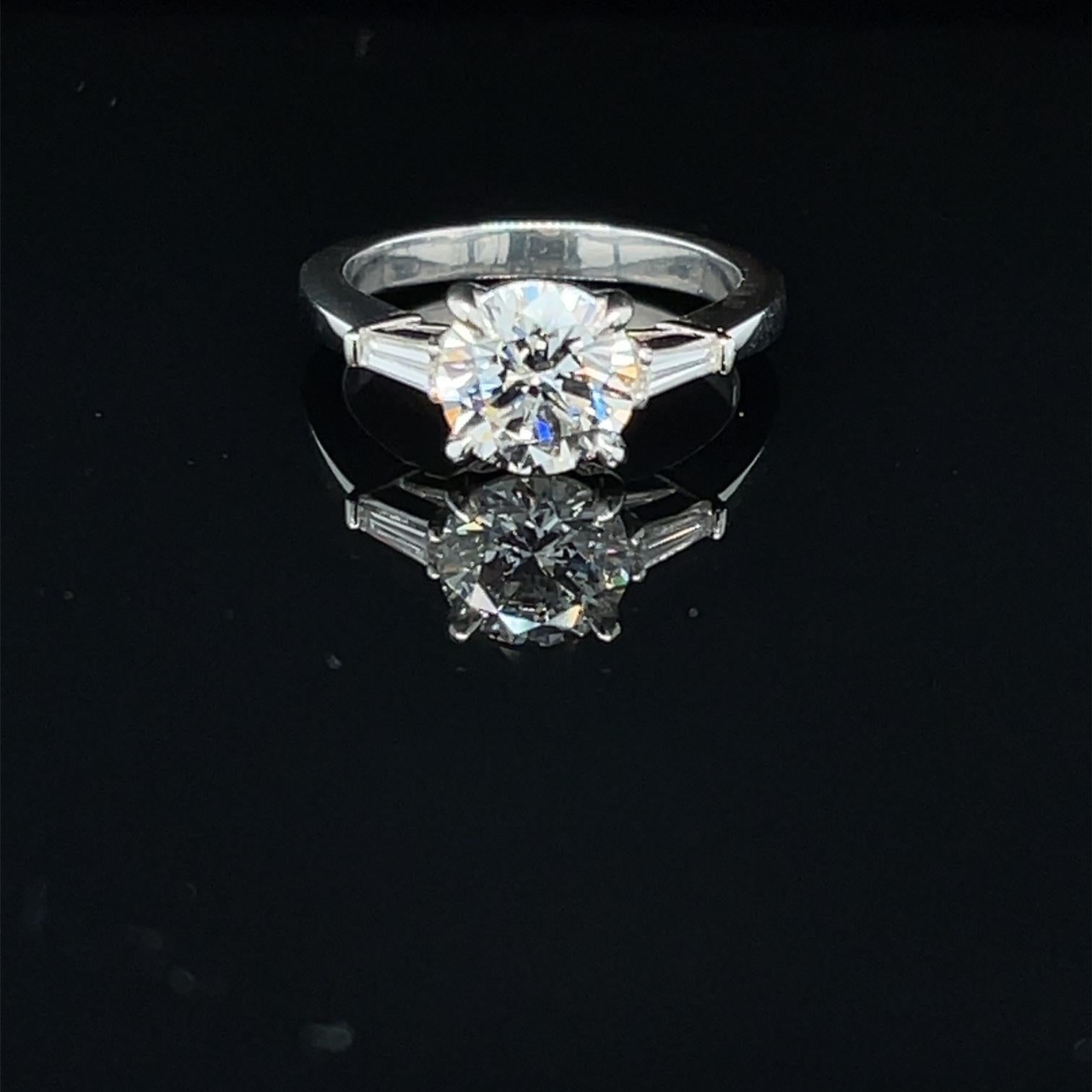 
DIAMOND AND PLATINUM ENGAGEMENT RING 1.72 CARATS
 
Round Diamond Center Stone 1.72 carats
 
J Color SI2 Clarity
 
With GIA Certificate # 2213161067
 
Tapered Baguette Diamonds 0.25 carat
 
Diamonds are H in Color and VS Clarity
 
Total Carat Weight