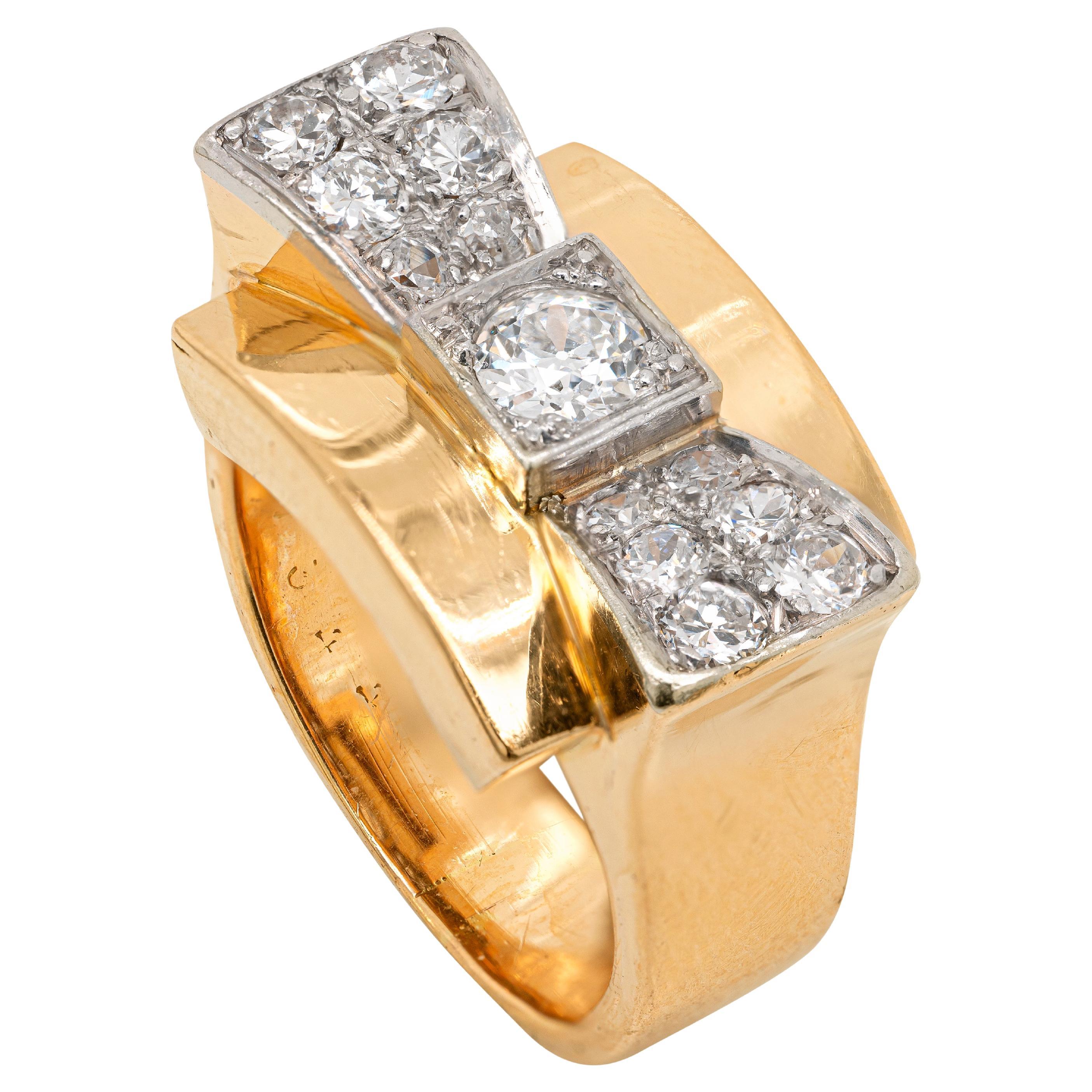 This vintage cocktail ring features a gorgeous bow tie in the centre, beautifully inlaid with 13 transitional cut diamonds weighing approximately 0.70ct in total, all mounted in platinum. The wonderful bow tie sits atop a solid yellow gold curved